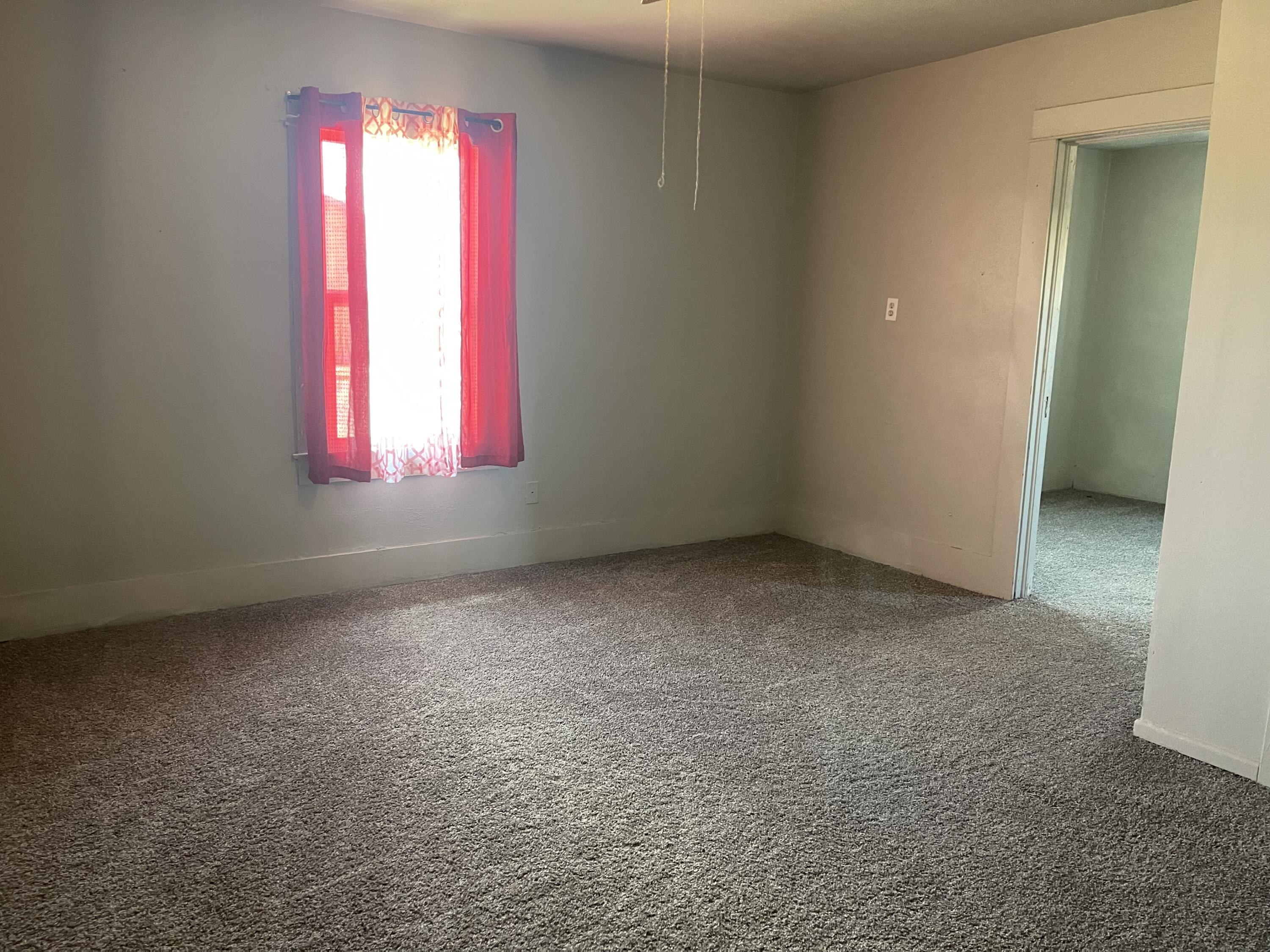 325 South 13th Street Slaton, TX 79364 - Photo 29 of 35 an empty room with a window