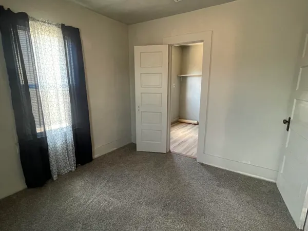 a view of a small space with racks on the wall
