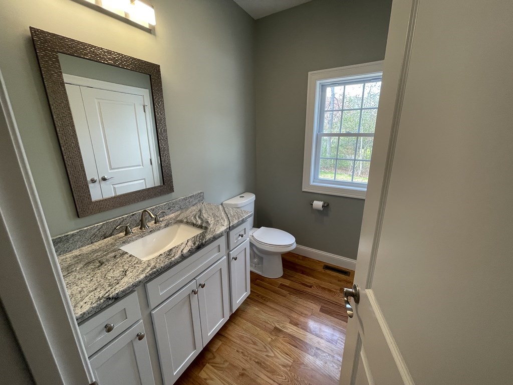 160 Canterbury Road Springfield, MA 01118 - Photo 9 of 20 a bathroom with a granite countertop sink toilet and mirror