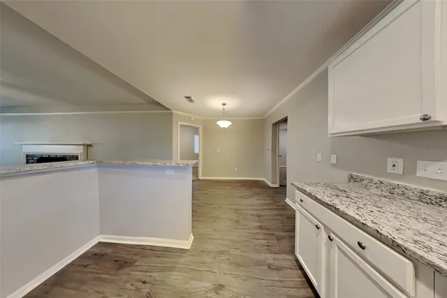 a view of a kitchen with a sink and dishwasher refrigerator stove
