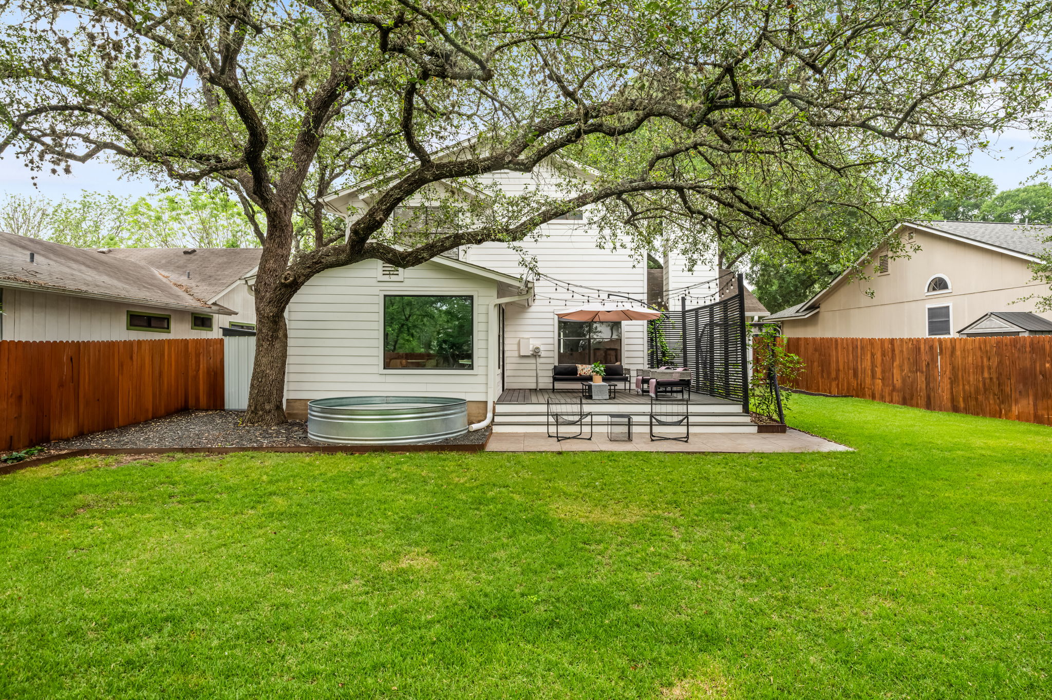 4506 Velasco Place Austin, TX 78749 - Photo 18 of 35 a view of a house with backyard and sitting area
