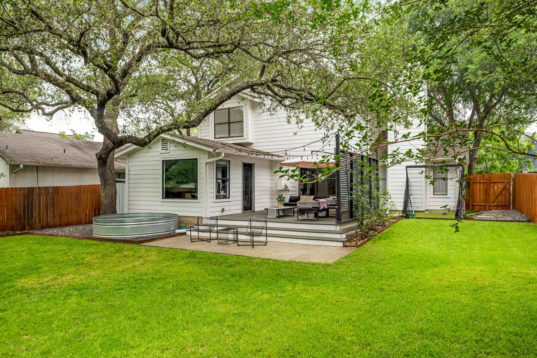 4506 Velasco Place Austin, TX 78749 - Photo 19 of 35 a view of a house with a yard and sitting area