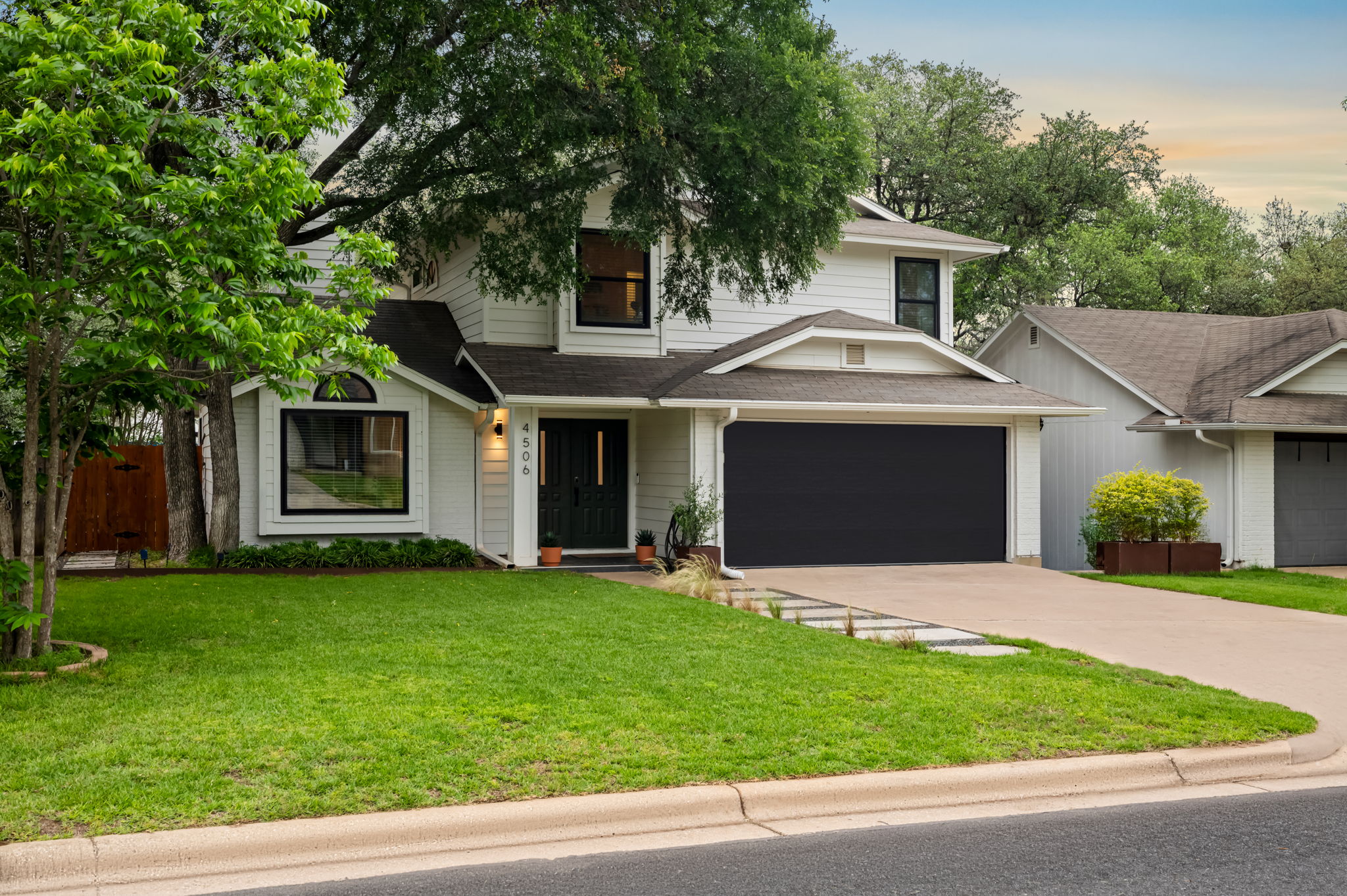 4506 Velasco Place Austin, TX 78749 - Photo 35 of 35 a front view of a house with a garden and yard