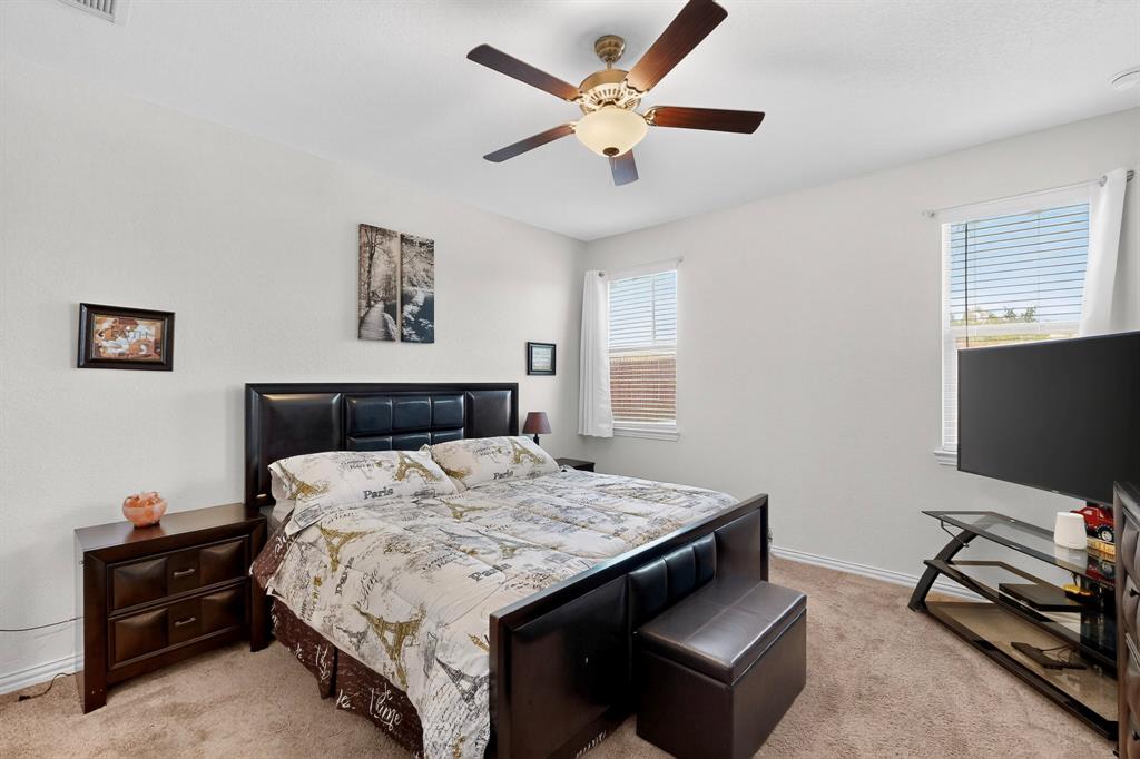 444 Ranchito Pass Fort Worth, TX 76052 - Photo 6 of 24 a bedroom with a bed and a flat screen tv