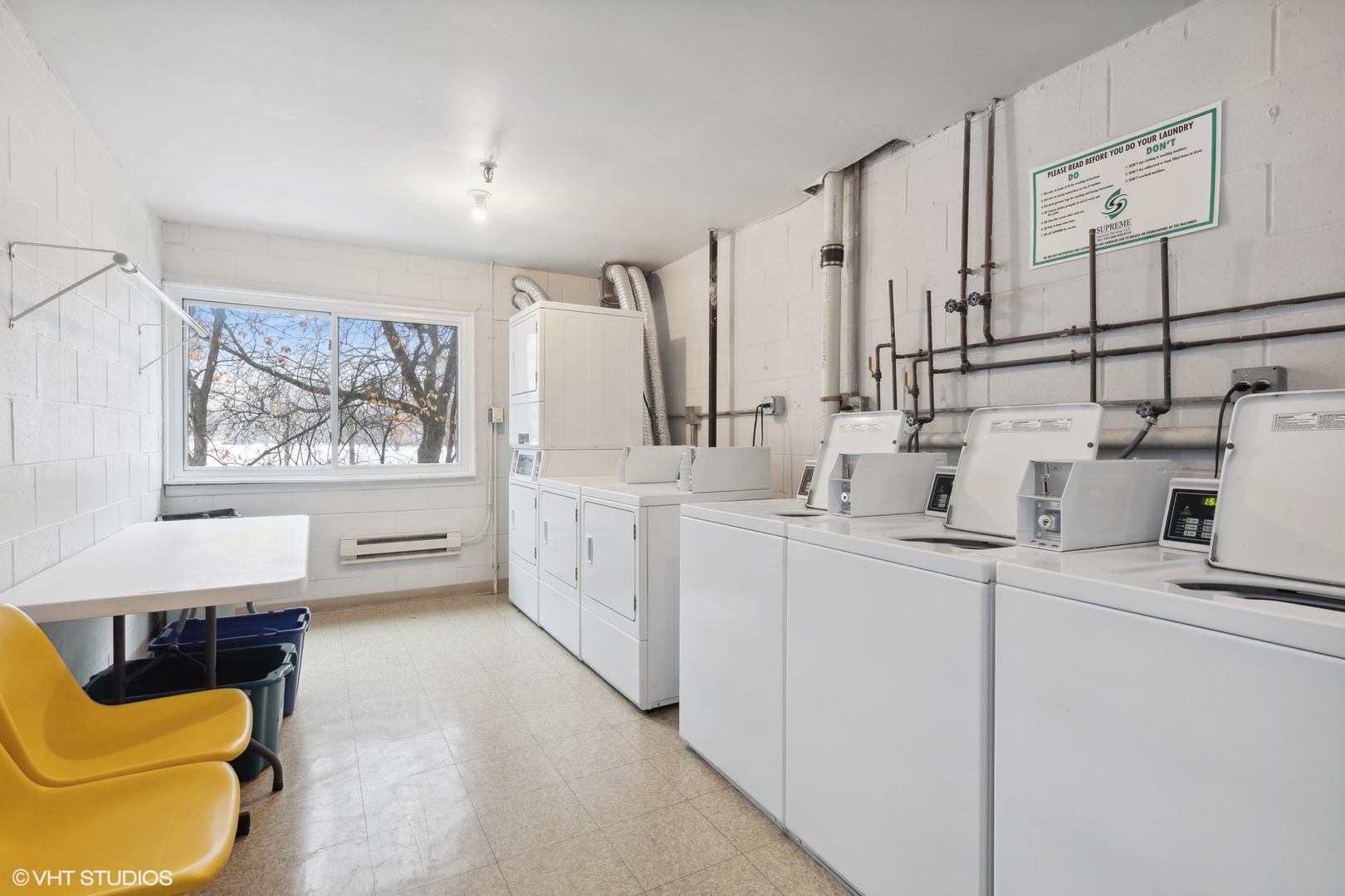 1400 North Elmhurst Road, Unit 103 Mount Prospect, IL 60056 - Photo 12 of 15 a kitchen with sink cabinets and window
