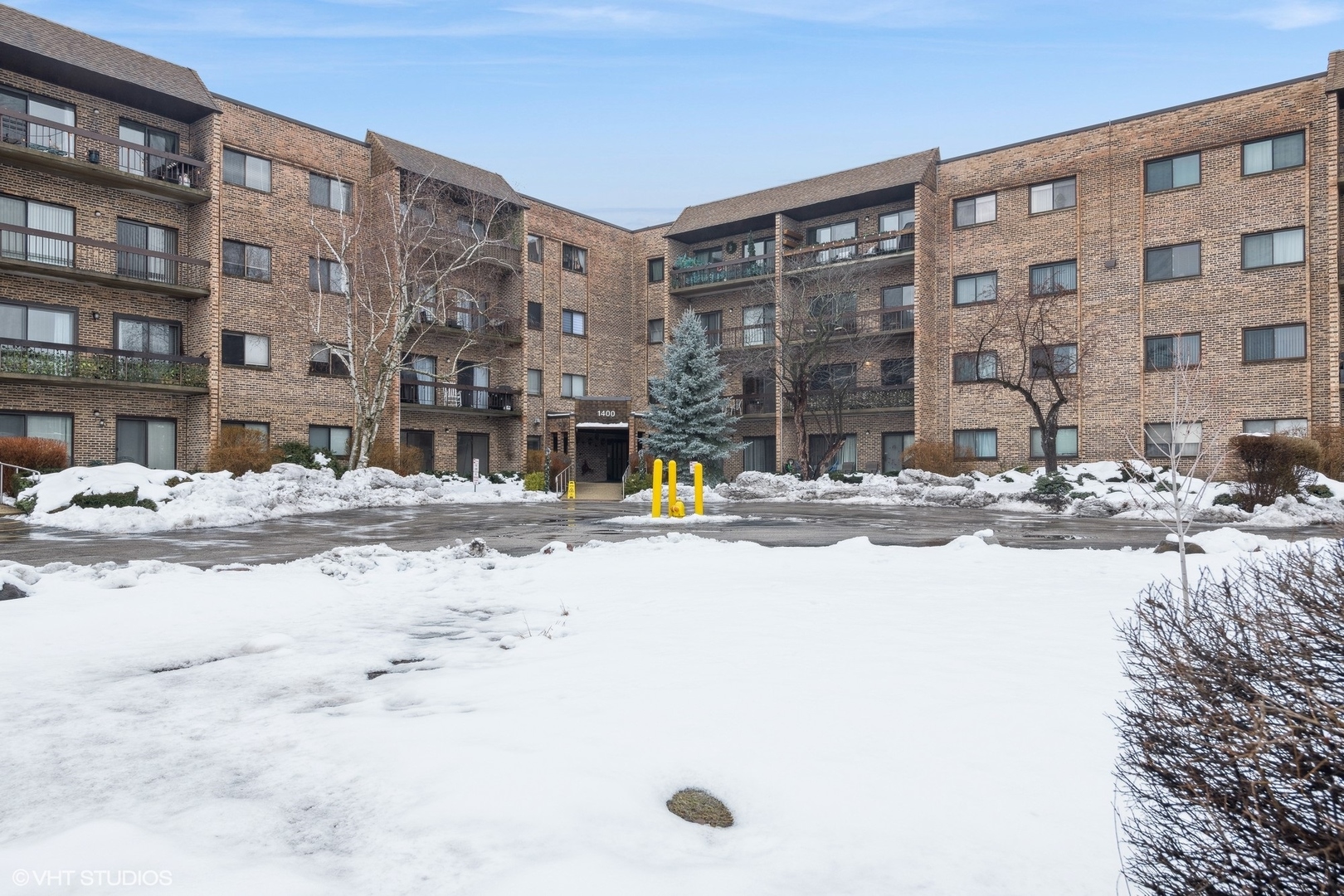 1400 North Elmhurst Road, Unit 103 Mount Prospect, IL 60056 - Photo 2 of 15 a view of tall buildings