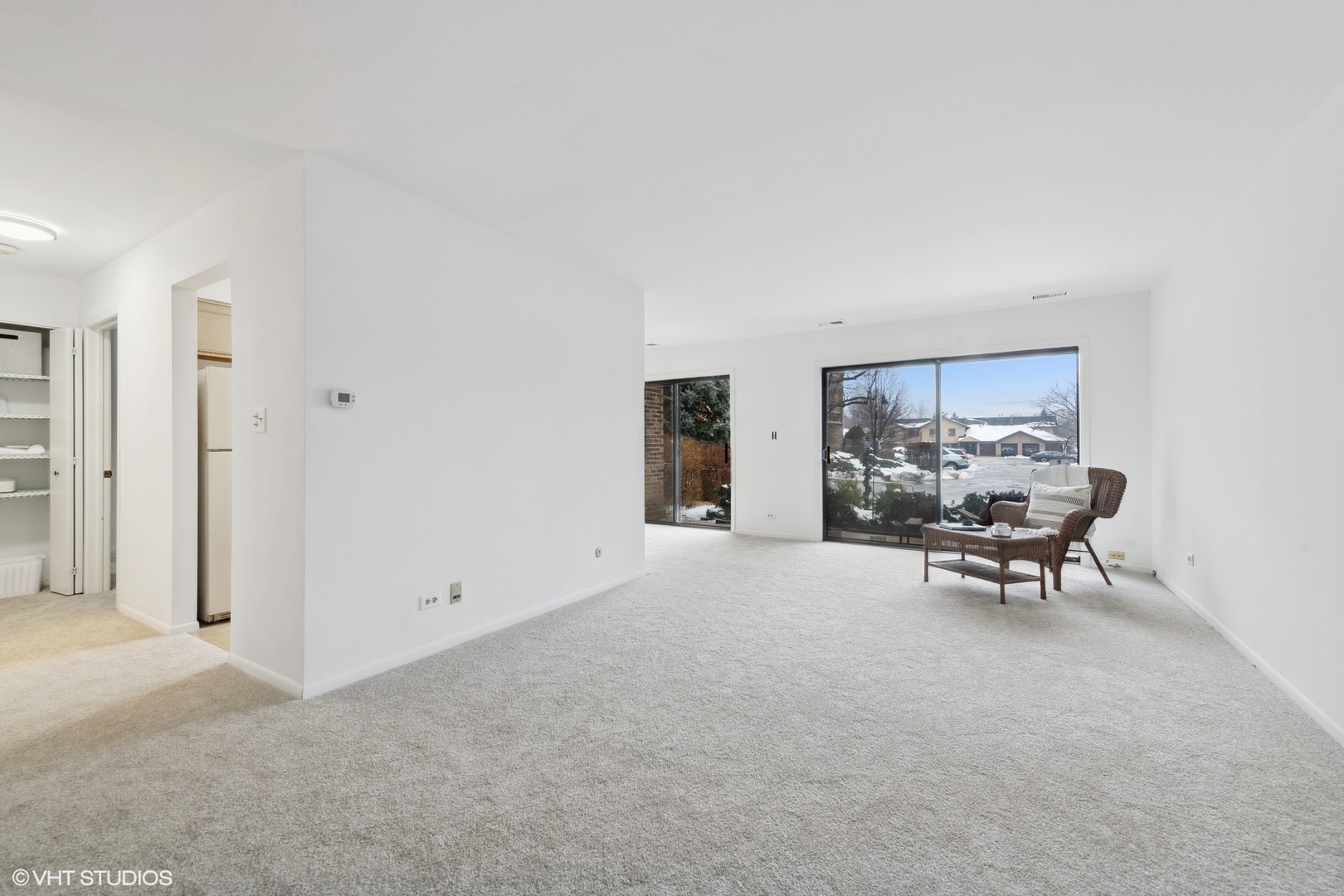 1400 North Elmhurst Road, Unit 103 Mount Prospect, IL 60056 - Photo 5 of 15 a living room with furniture and next to a window