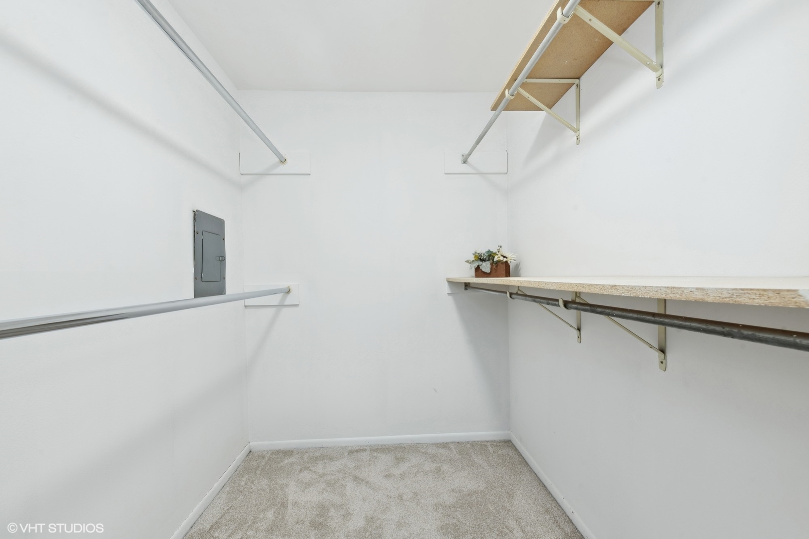 1400 North Elmhurst Road, Unit 103 Mount Prospect, IL 60056 - Photo 9 of 15 a view of walk in closet with empty racks