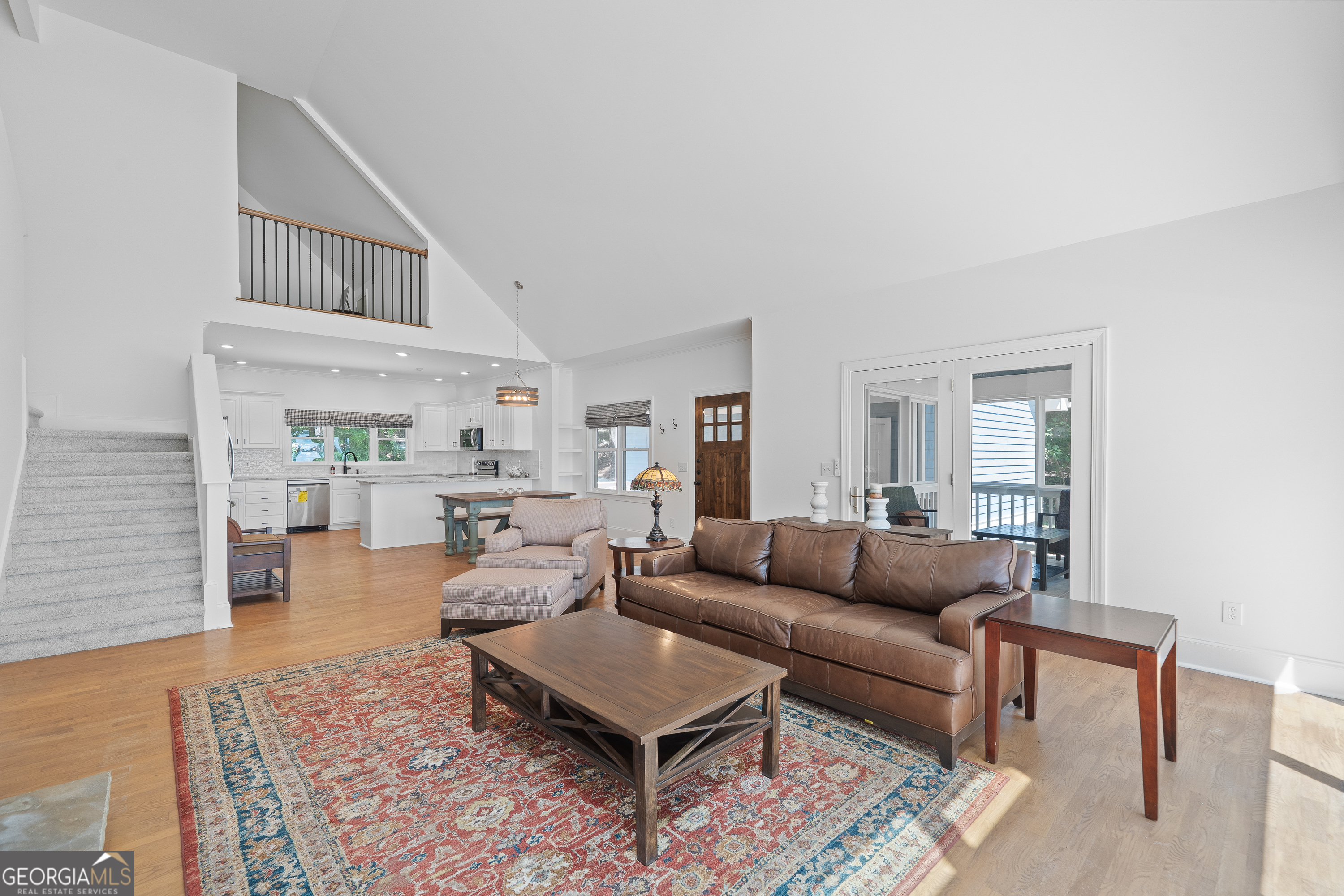 264 Winding River Road Eatonton, GA 31024 - Photo 12 of 72 a living room with furniture and a rug