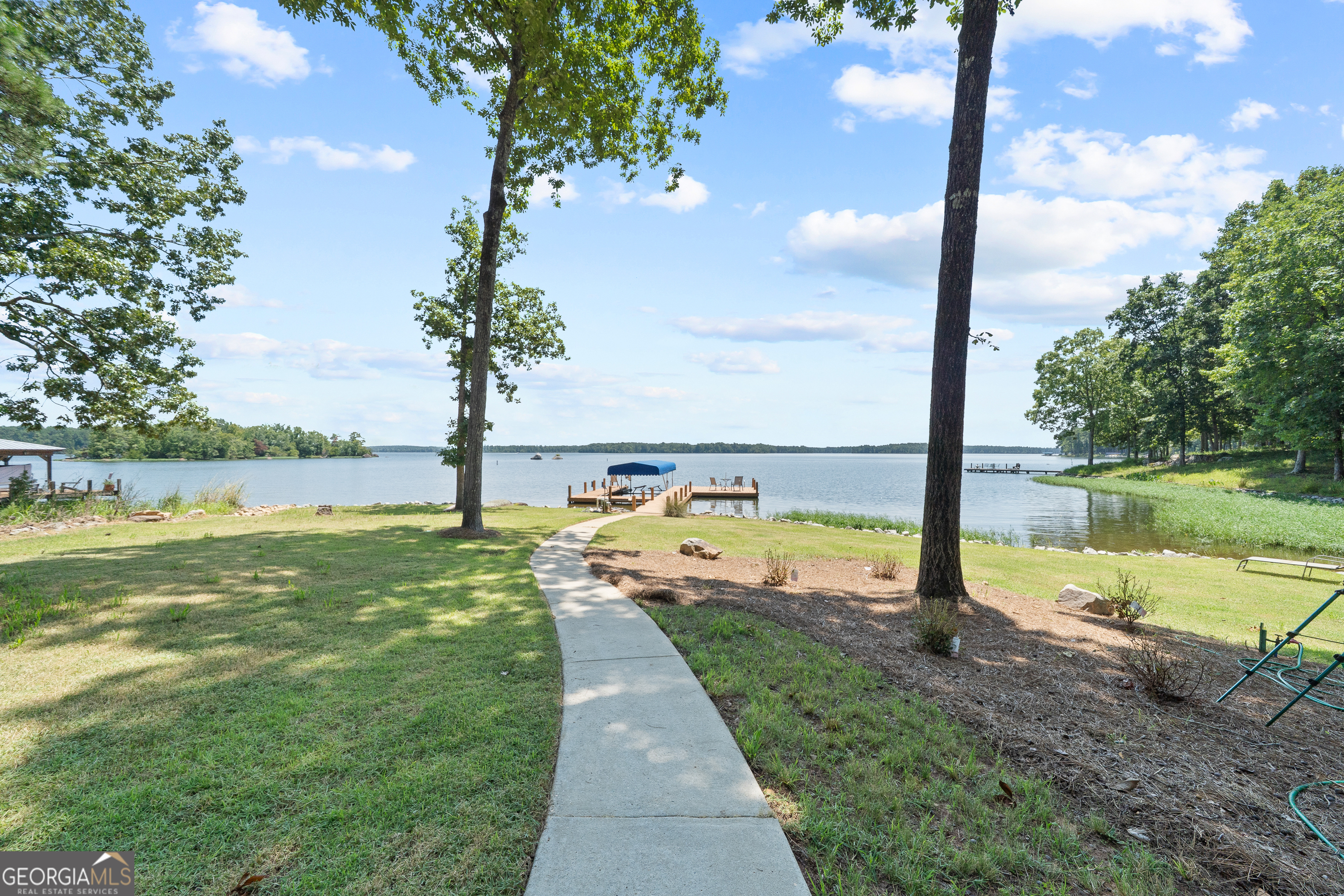 264 Winding River Road Eatonton, GA 31024 - Photo 2 of 72 a view of a lake with a ocean view