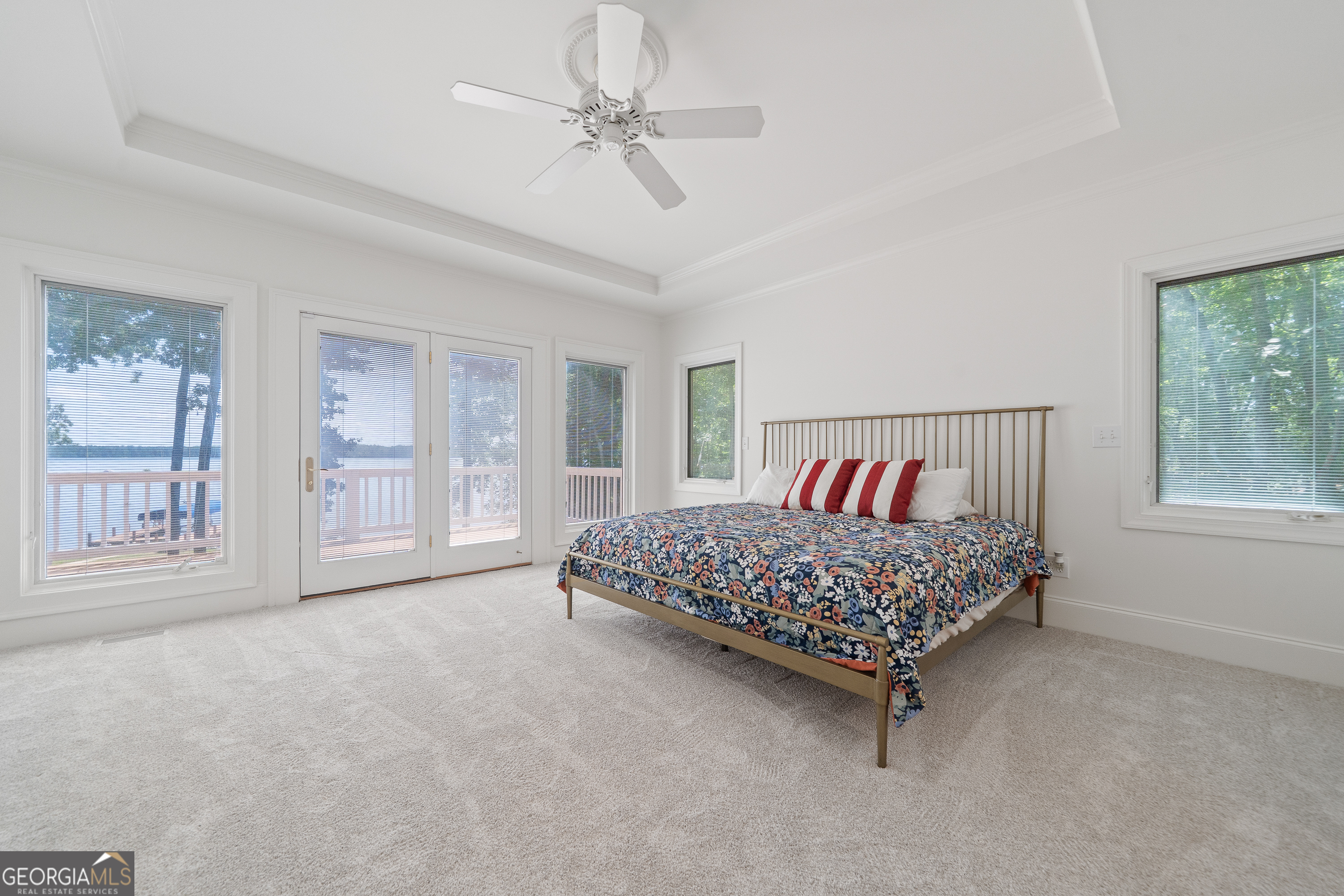 264 Winding River Road Eatonton, GA 31024 - Photo 29 of 72 a bed sitting in a bedroom next to a window