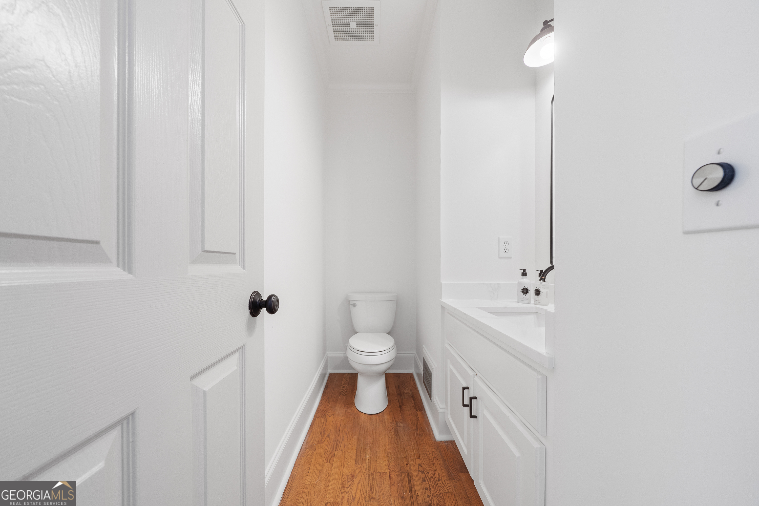 264 Winding River Road Eatonton, GA 31024 - Photo 39 of 72 a spacious bathroom with a double vanity sink and a toilet