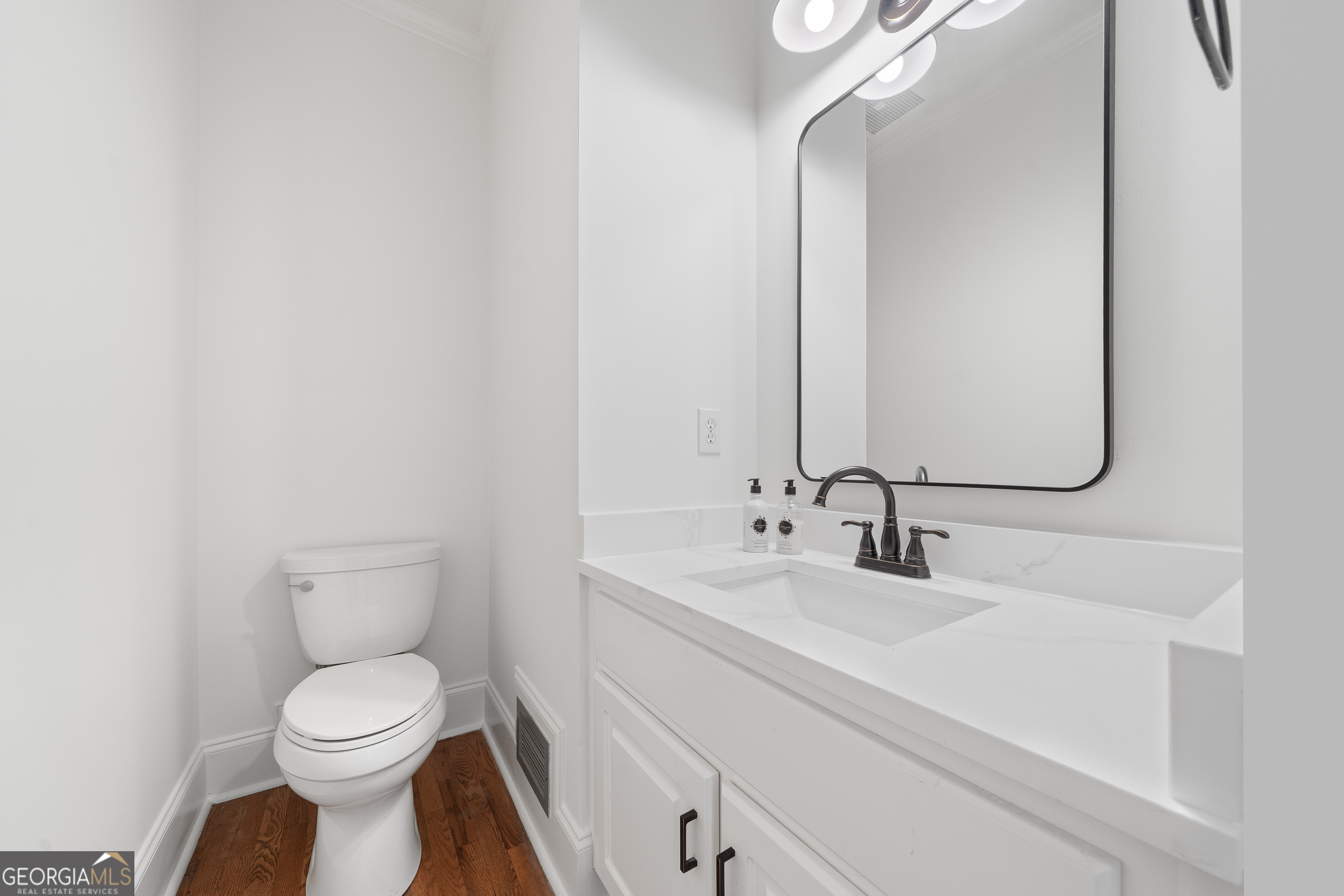 264 Winding River Road Eatonton, GA 31024 - Photo 40 of 72 a bathroom with a toilet sink and mirror