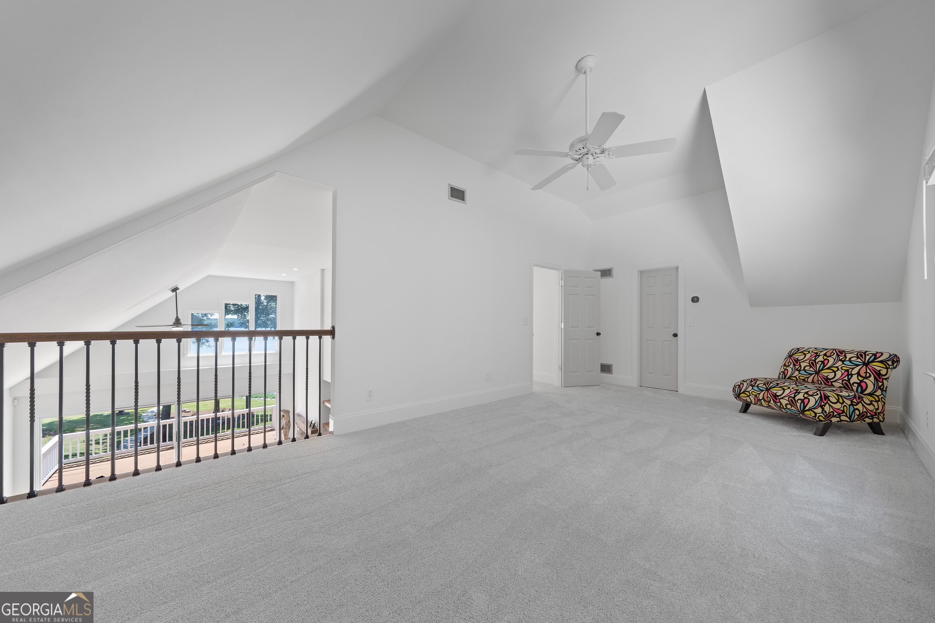 264 Winding River Road Eatonton, GA 31024 - Photo 47 of 72 an empty room with a ceiling fan and window