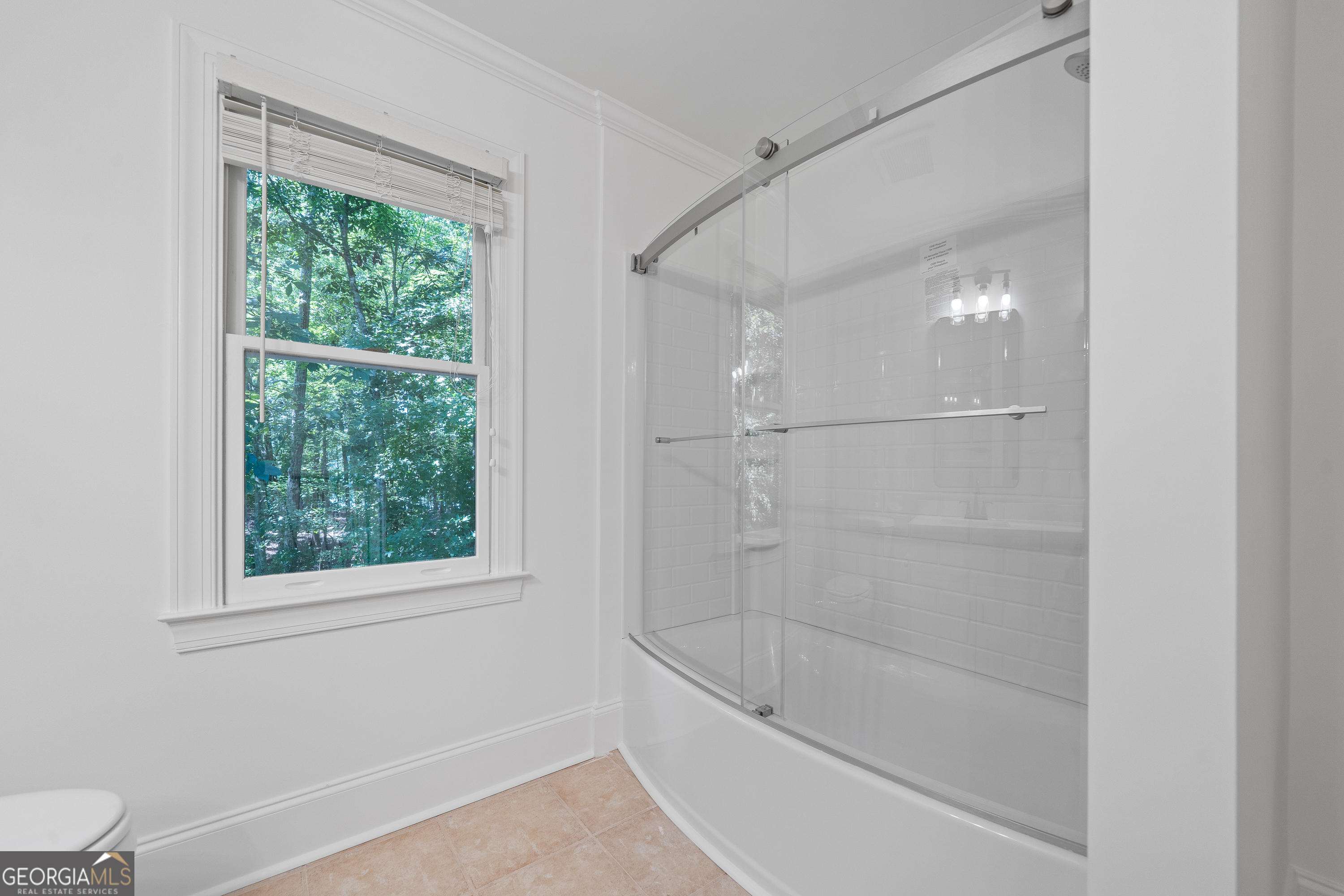 264 Winding River Road Eatonton, GA 31024 - Photo 49 of 72 a bathroom with a bathtub and a shower