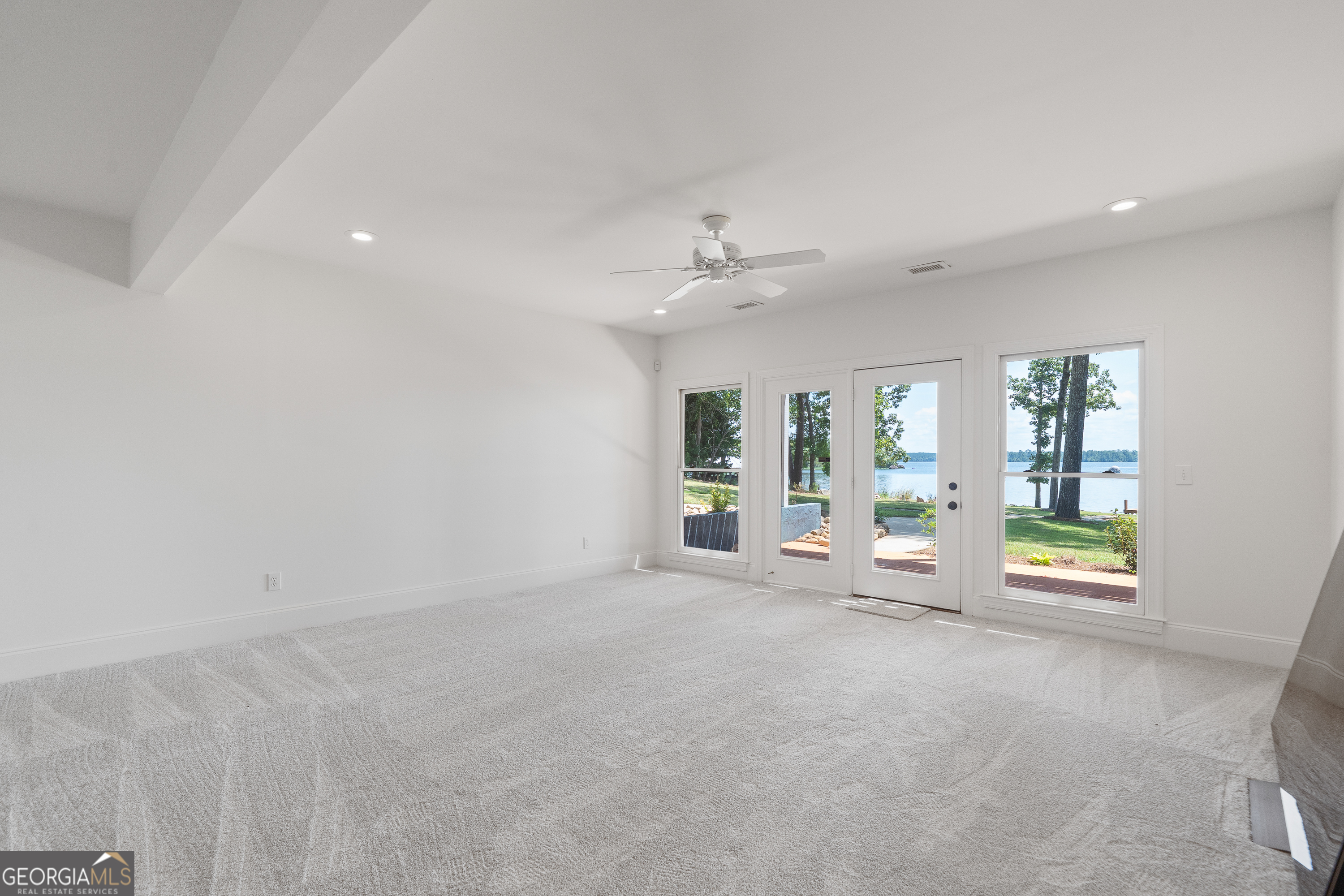 264 Winding River Road Eatonton, GA 31024 - Photo 50 of 72 a view of an empty room with a window