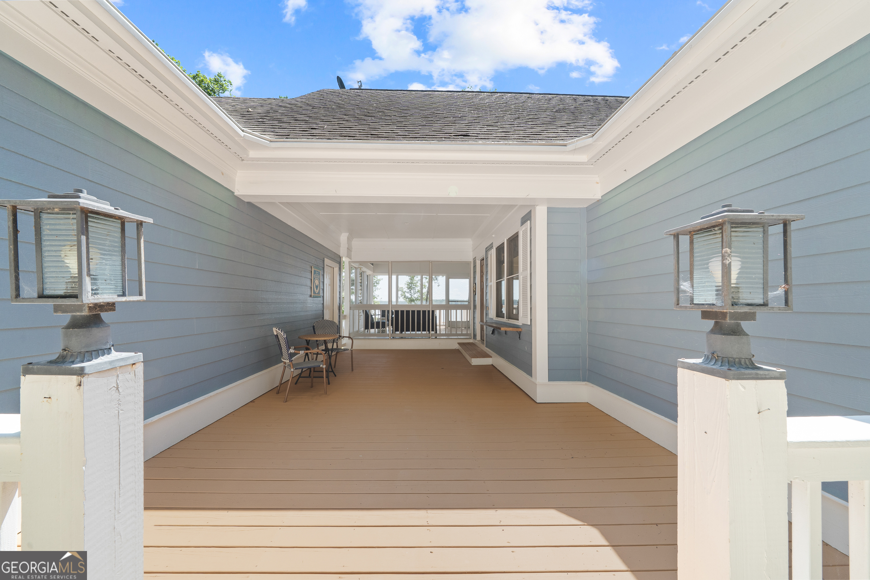 264 Winding River Road Eatonton, GA 31024 - Photo 5 of 72 a view of a livingroom with wooden floor and chandelier