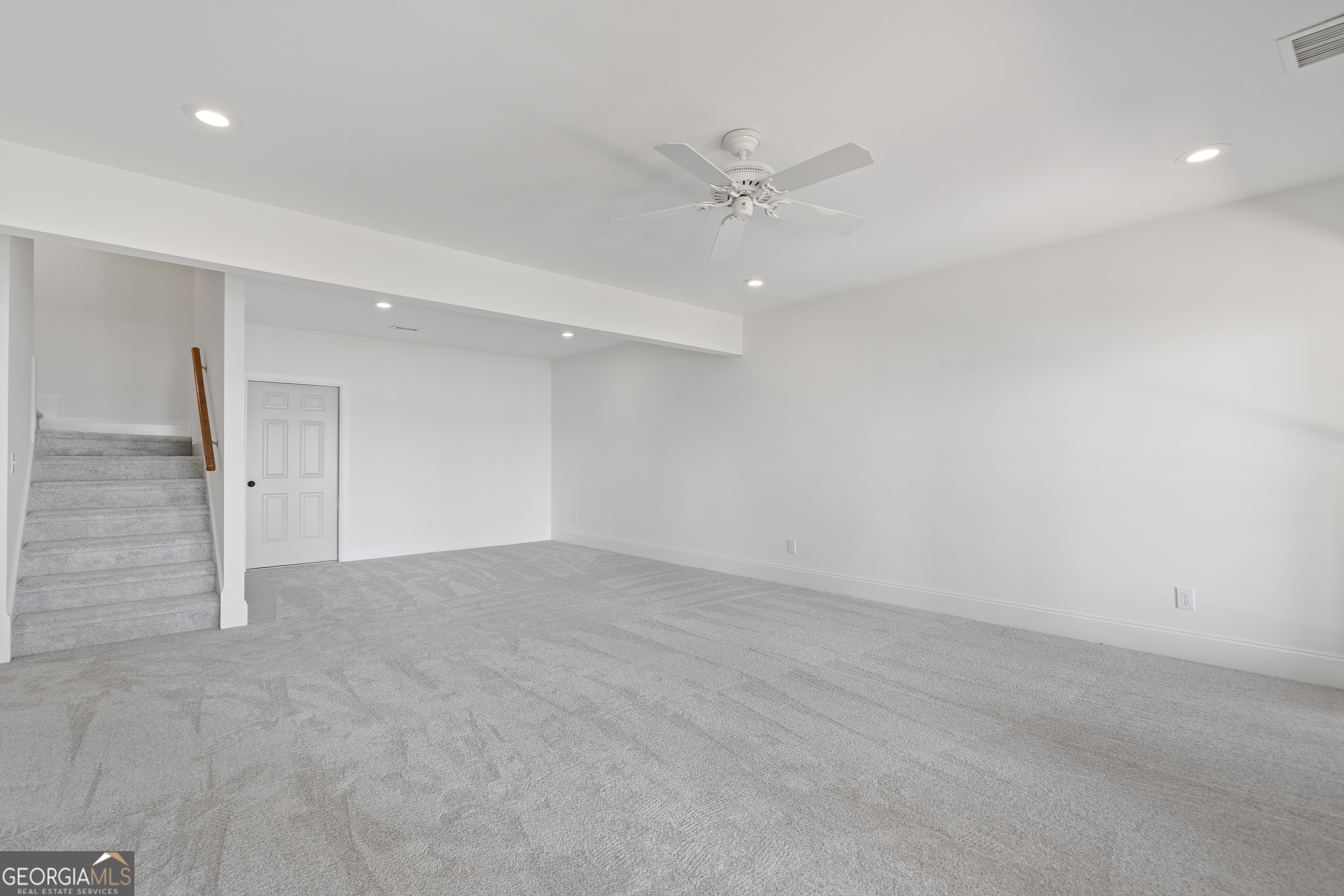 264 Winding River Road Eatonton, GA 31024 - Photo 52 of 72 an empty room with a ceiling fan and a window