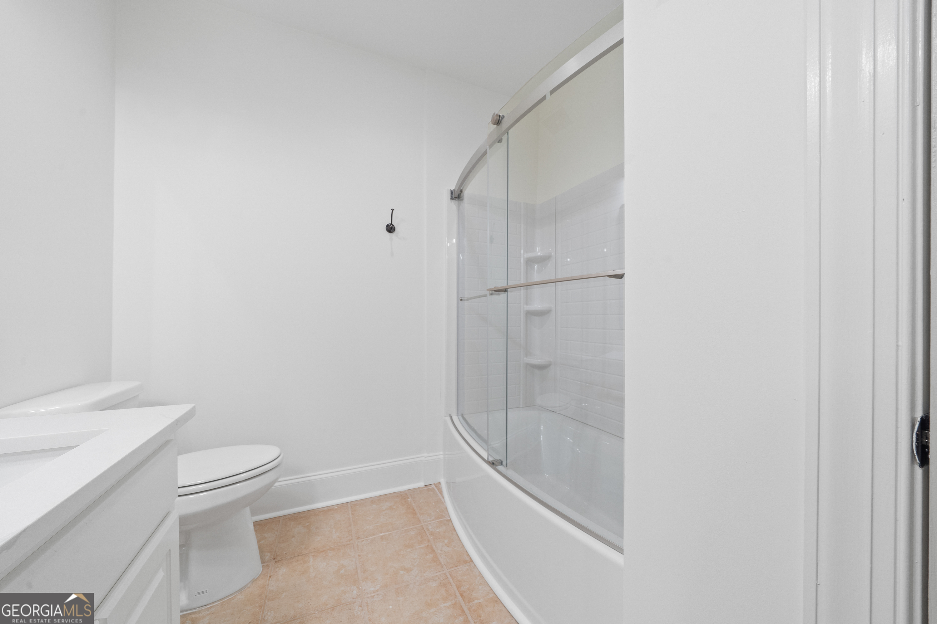 264 Winding River Road Eatonton, GA 31024 - Photo 56 of 72 a bathroom with a granite countertop sink toilet and shower