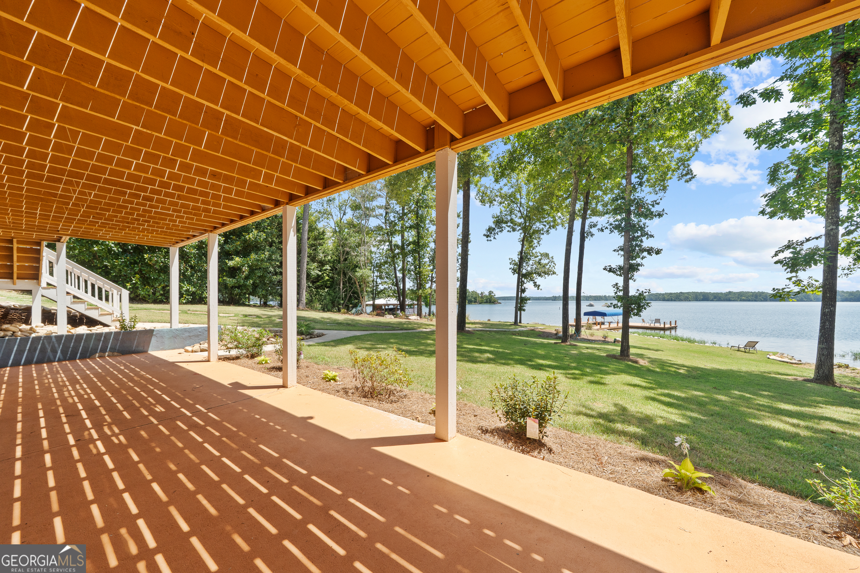 264 Winding River Road Eatonton, GA 31024 - Photo 58 of 72 a view of a house with a backyard