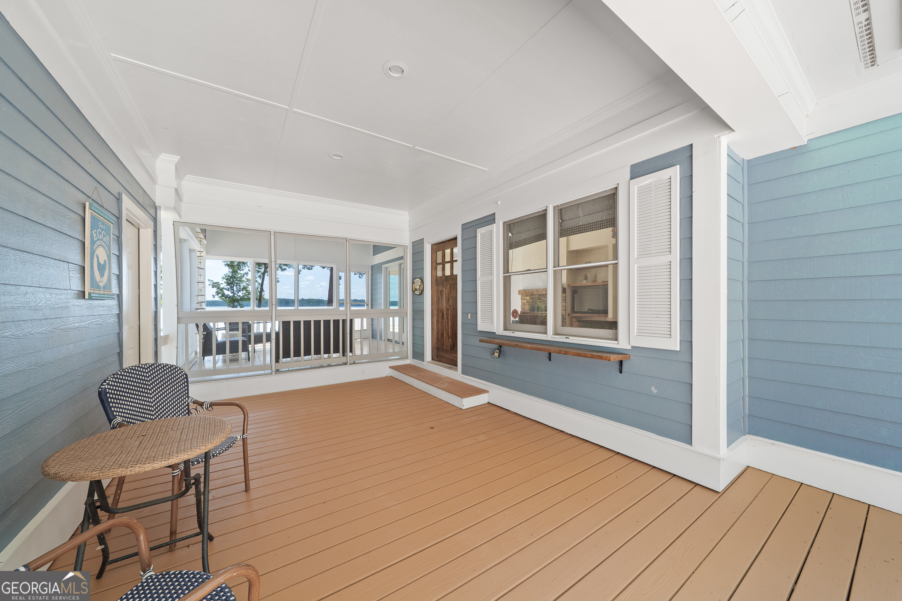 264 Winding River Road Eatonton, GA 31024 - Photo 6 of 72 a view of an empty room with wooden floor and a window