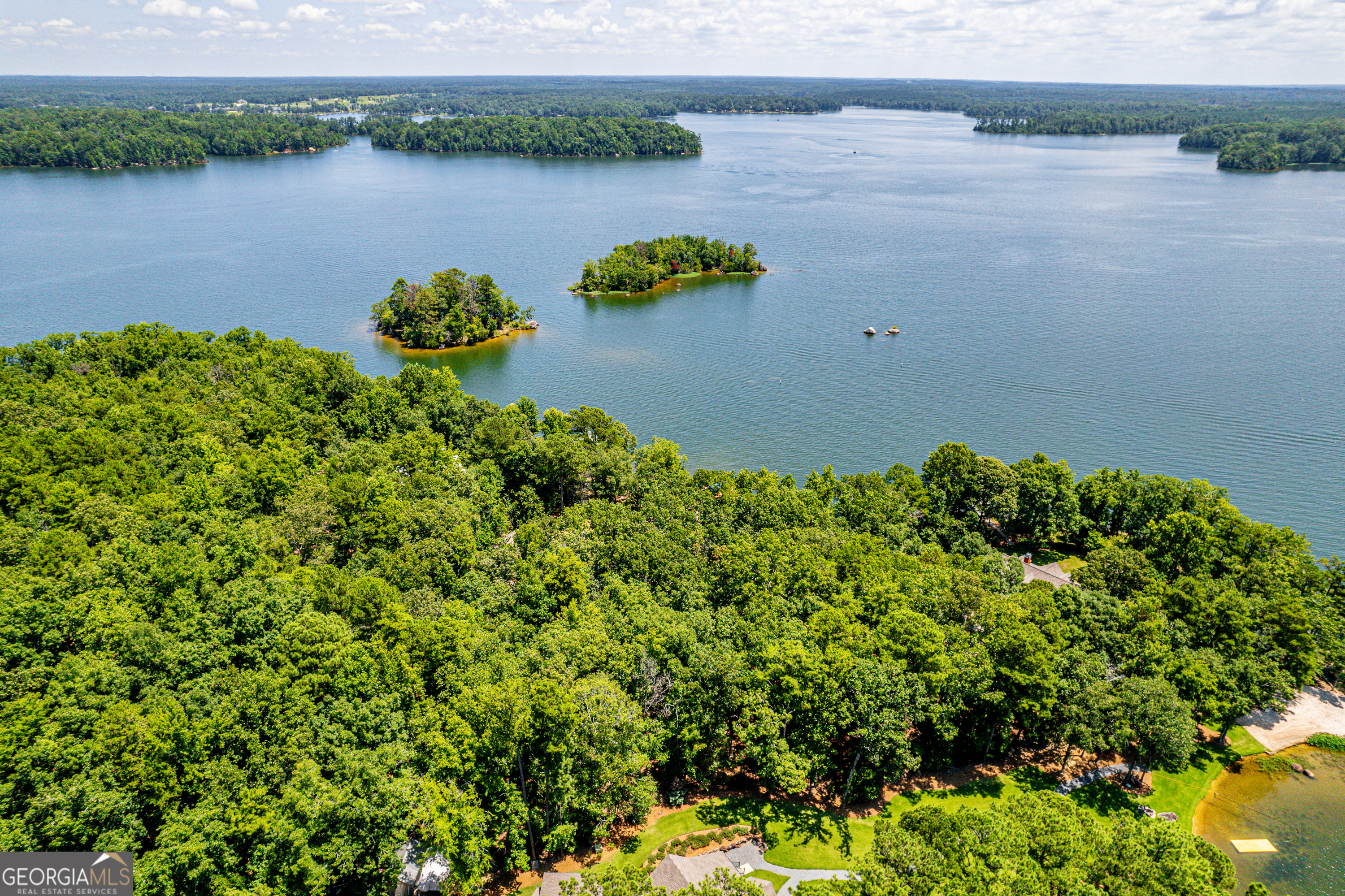 264 Winding River Road Eatonton, GA 31024 - Photo 72 of 72 a view of a lake with a outdoor space