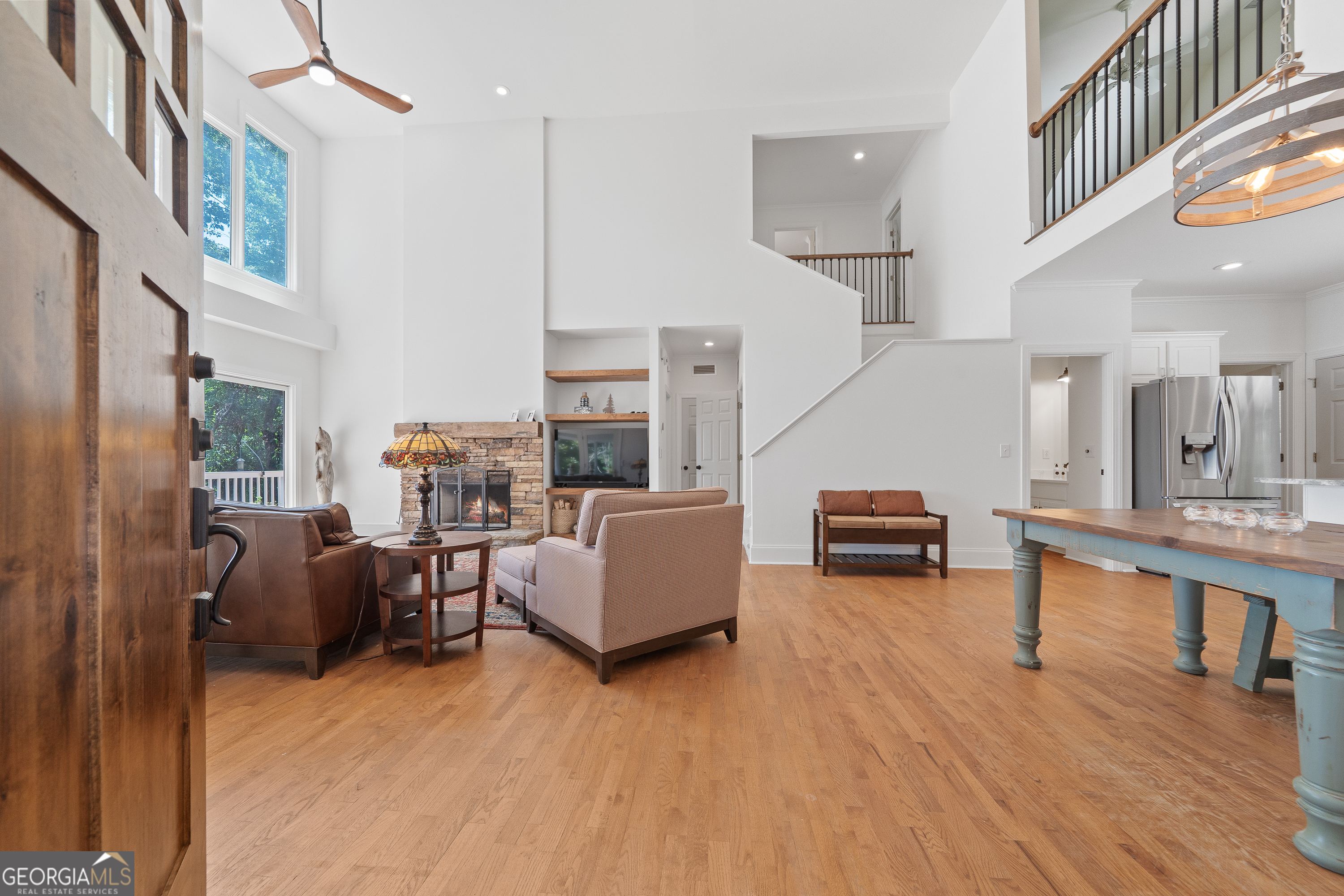 264 Winding River Road Eatonton, GA 31024 - Photo 8 of 72 a living room with furniture and a wooden floor