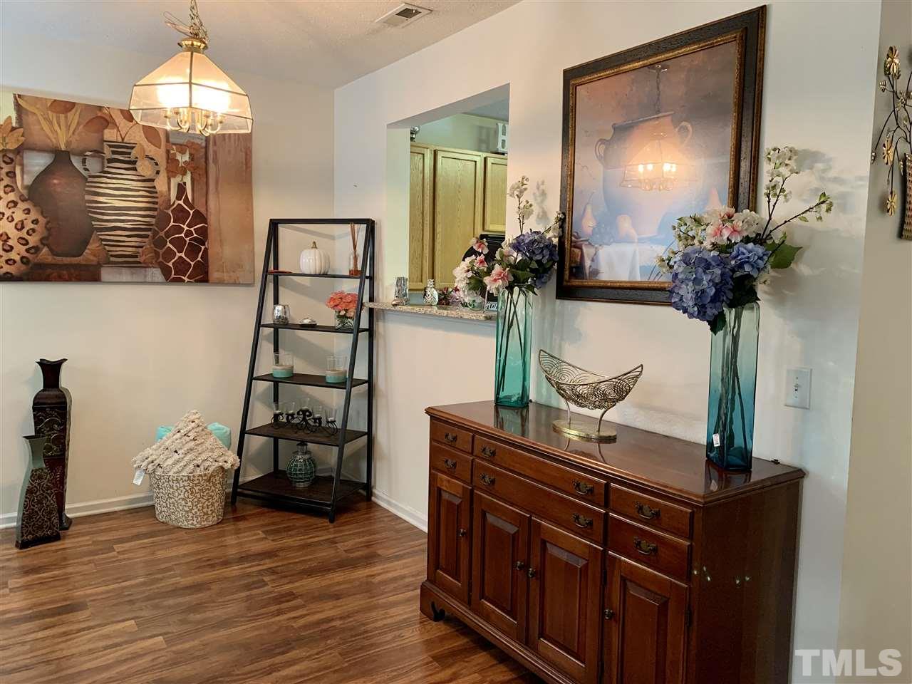 506 Huron Road Raleigh, NC 27610 - Photo 12 of 29 a view of hall way with furniture and chandelier