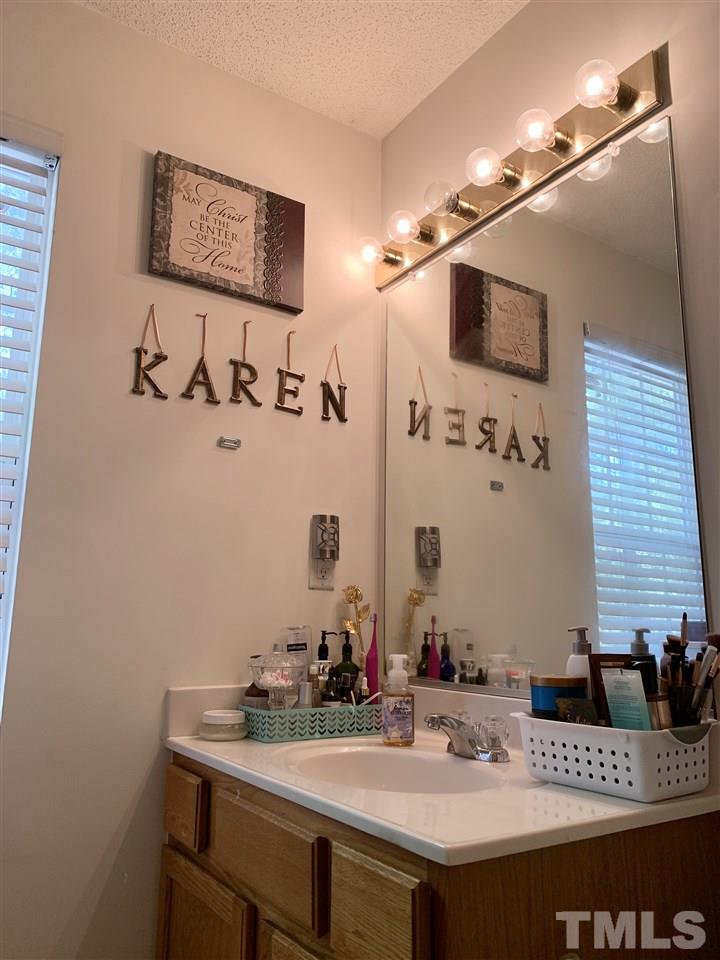 506 Huron Road Raleigh, NC 27610 - Photo 24 of 29 a bathroom with a sink and a mirror