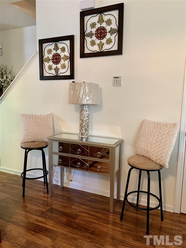 506 Huron Road Raleigh, NC 27610 - Photo 10 of 29 a dining room with furniture and wooden floor