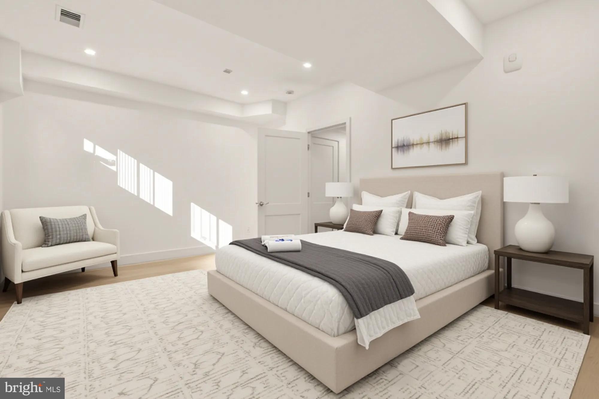 1810 Central Place Northeast, Unit 1 Washington, DC 20002 - Photo 18 of 32 a large white bed in a white room