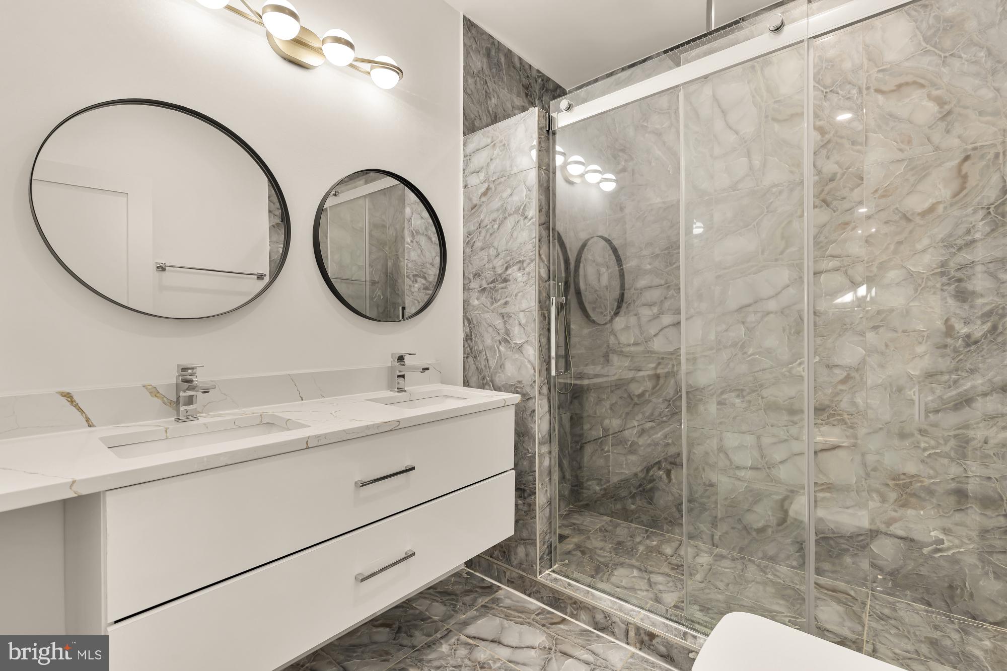 1810 Central Place Northeast, Unit 1 Washington, DC 20002 - Photo 21 of 32 a bathroom with a toilet a sink and a mirror