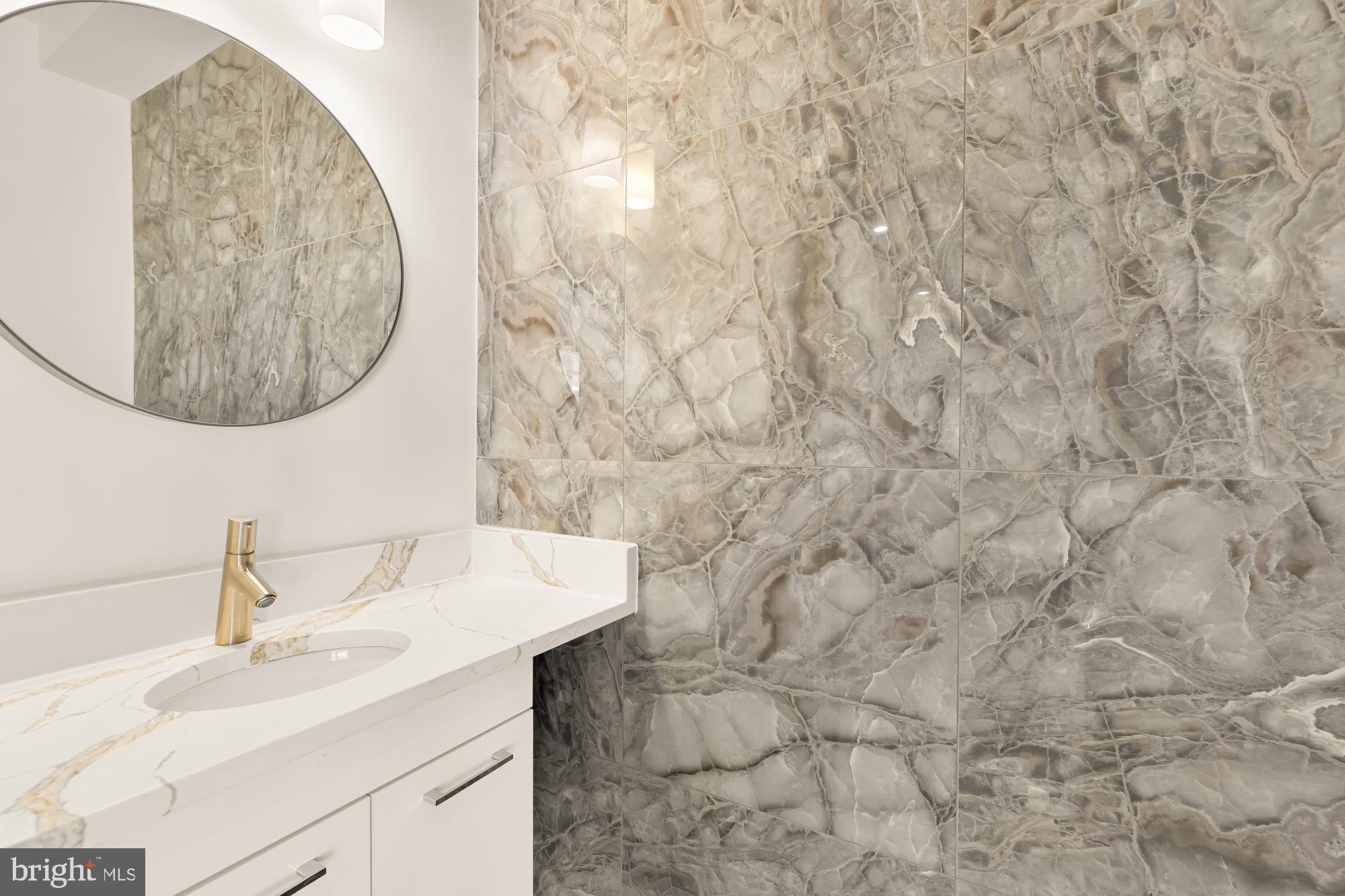 1810 Central Place Northeast, Unit 1 Washington, DC 20002 - Photo 6 of 32 a bathroom with a sink and a mirror