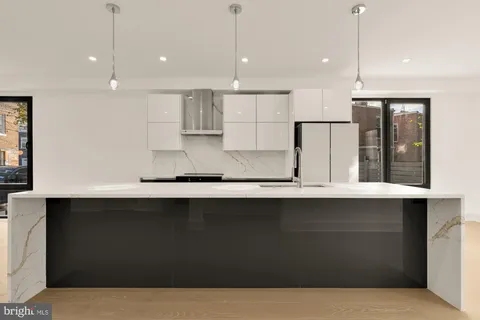 a kitchen with counter top space cabinets and appliances