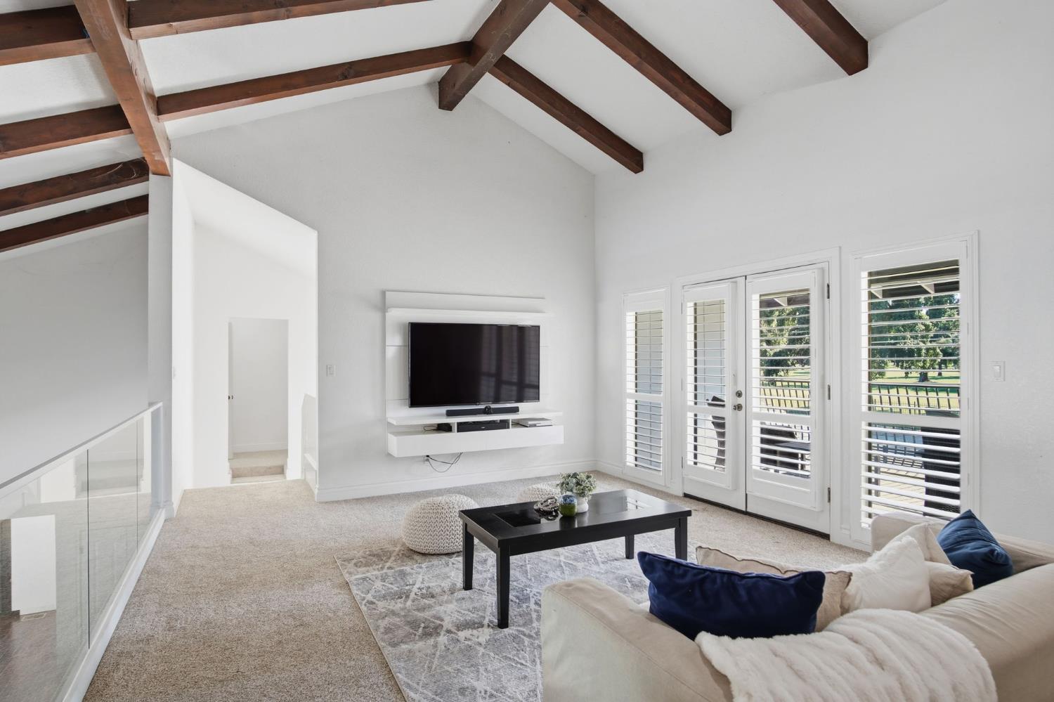 10401 Golf Link Road Turlock, CA 95380 - Photo 29 of 63 a living room with furniture and a flat screen tv