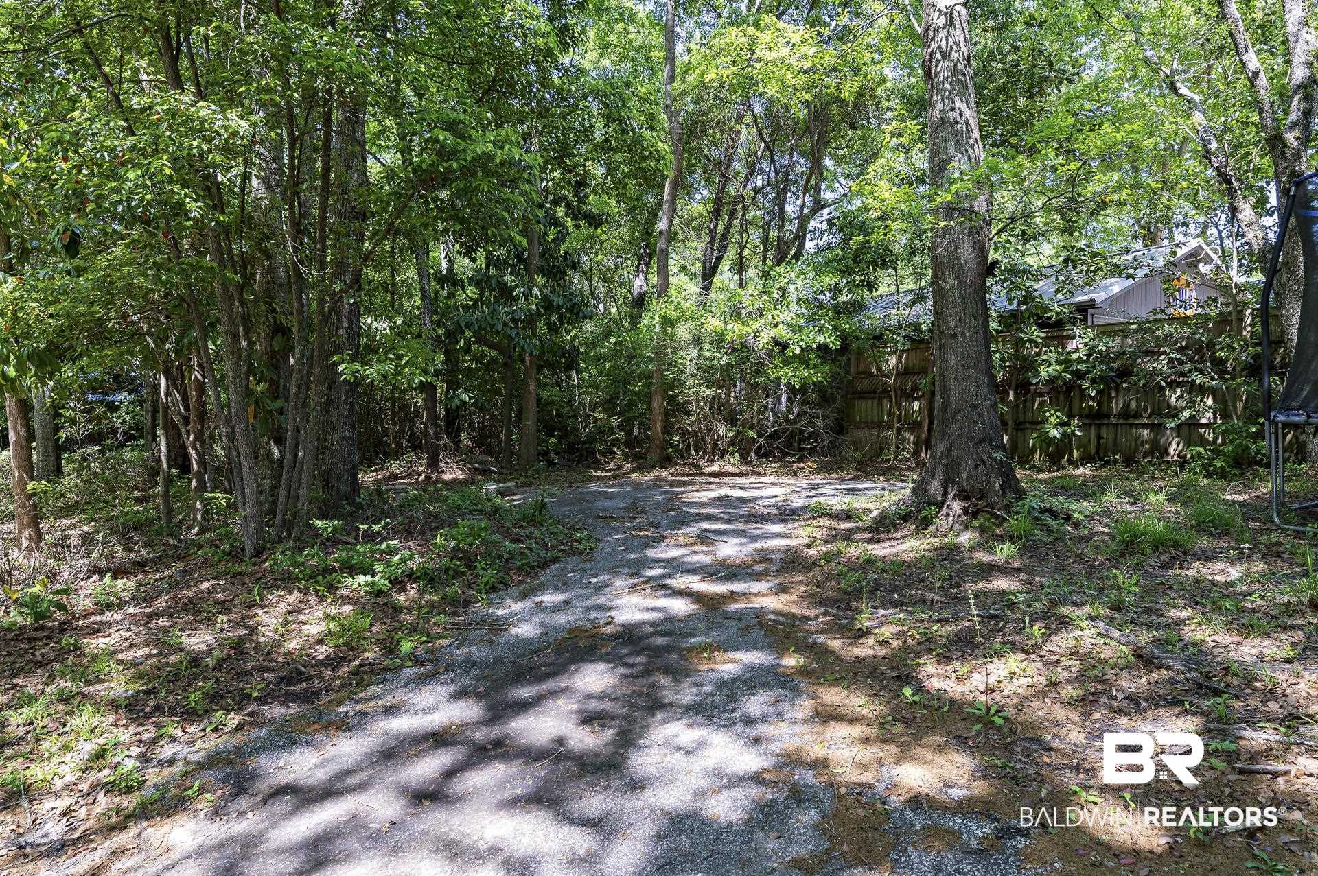 707 Johnson Avenue Fairhope, AL 36532 - Photo 12 of 38 View of street with a wooded view