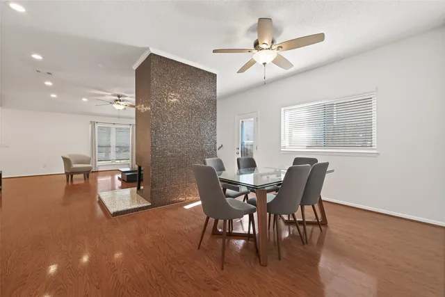 a dining room with furniture and window