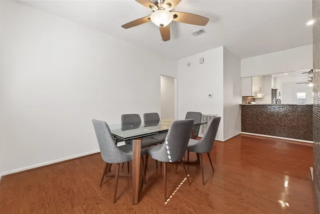 a view of a kitchen with a sink and a refrigerator