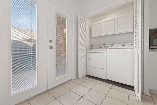 a spacious bedroom with a bed and a ceiling fan