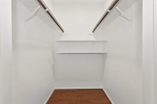 a white toilet sitting next to a shower