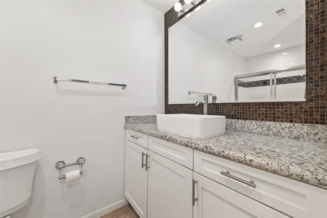 a bedroom with furniture and wooden floor