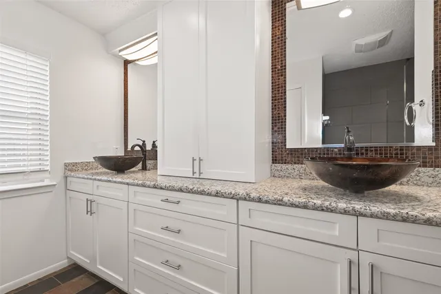 a white toilet sitting next to a bathroom