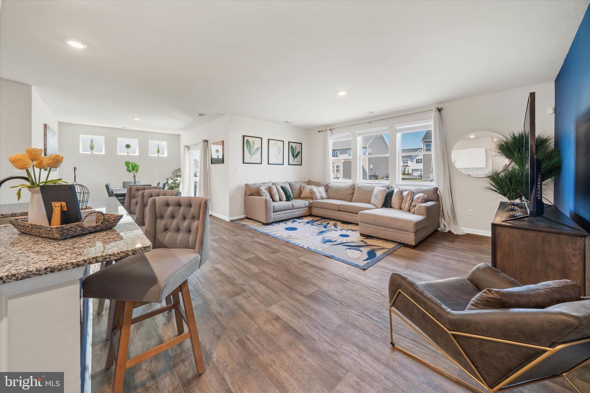 735 Red Maple Road Smyrna, DE 19977 - Photo 42 of 42 a living room with furniture and a wooden floor