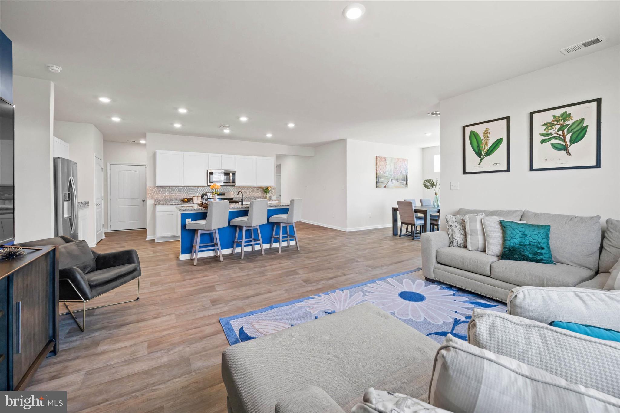 735 Red Maple Road Smyrna, DE 19977 - Photo 15 of 42 a living room with furniture and kitchen view