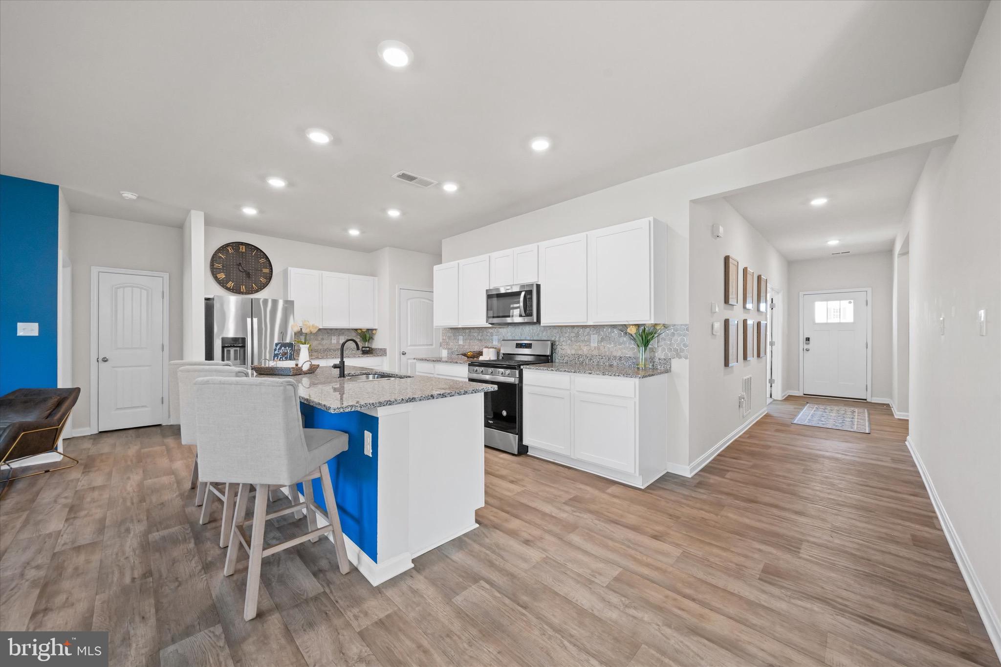 735 Red Maple Road Smyrna, DE 19977 - Photo 17 of 42 a kitchen with a sink and wooden floor