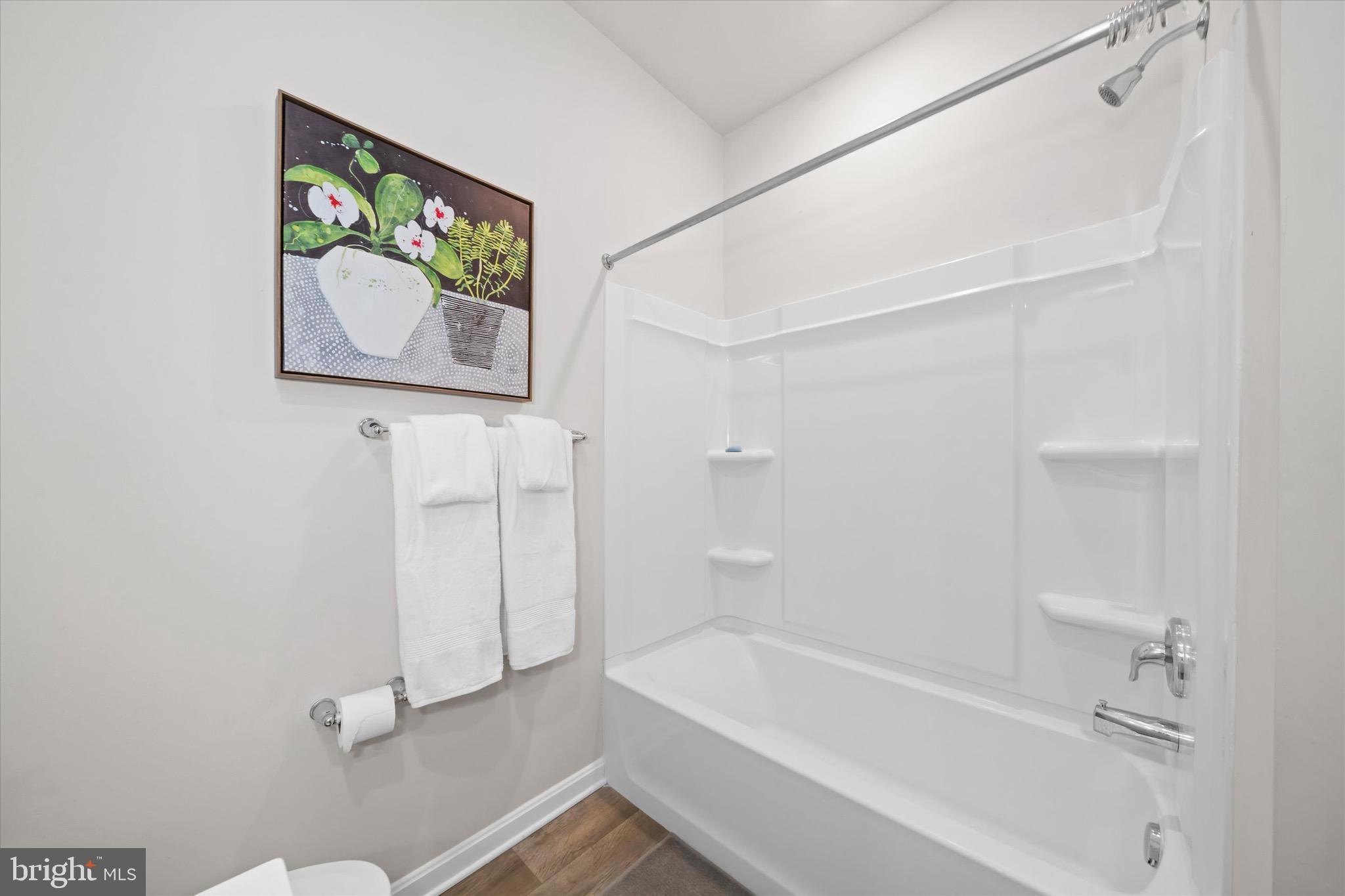 735 Red Maple Road Smyrna, DE 19977 - Photo 29 of 42 a bathroom with a bathtub and shower