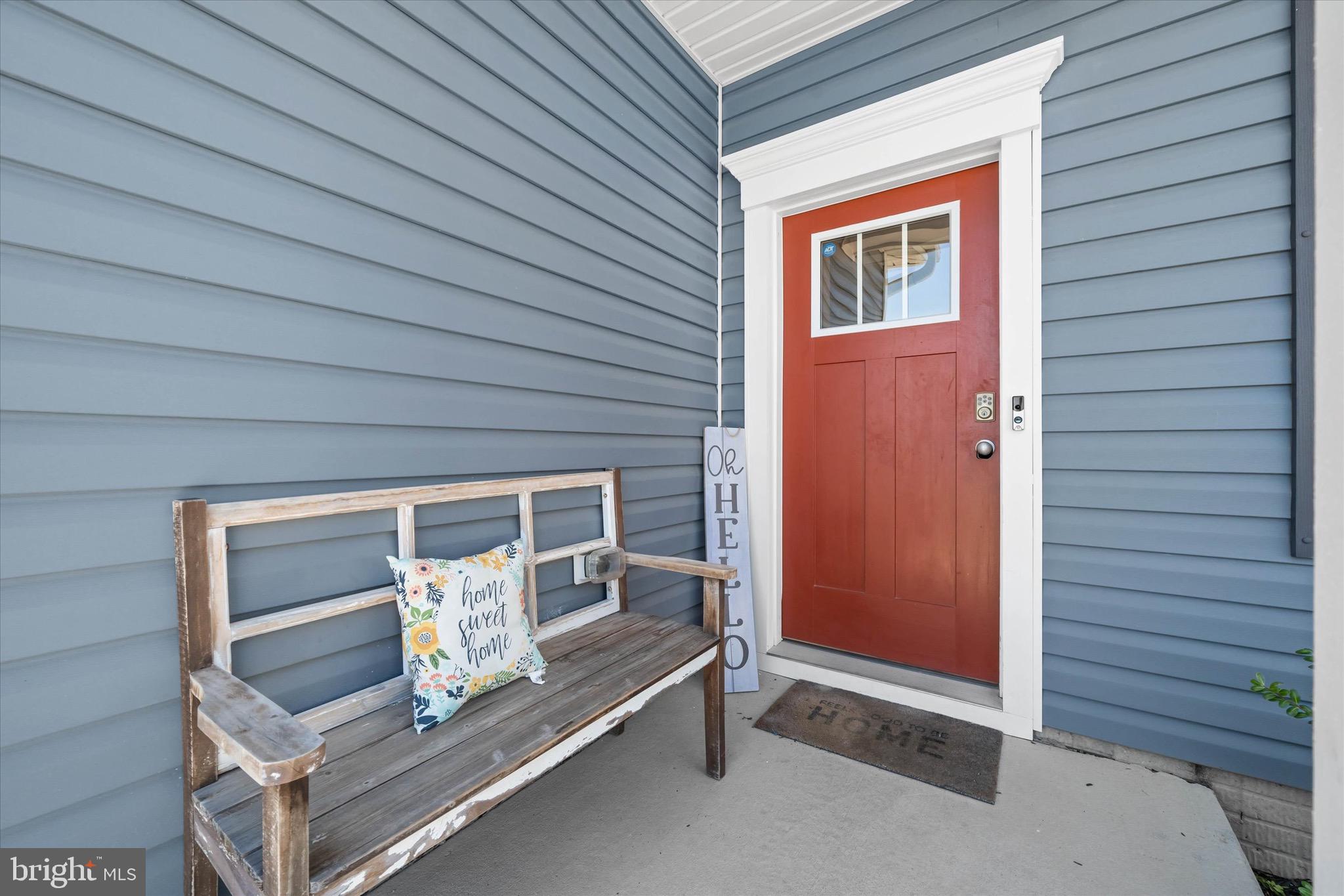 735 Red Maple Road Smyrna, DE 19977 - Photo 6 of 42 a front view of a house with entryway