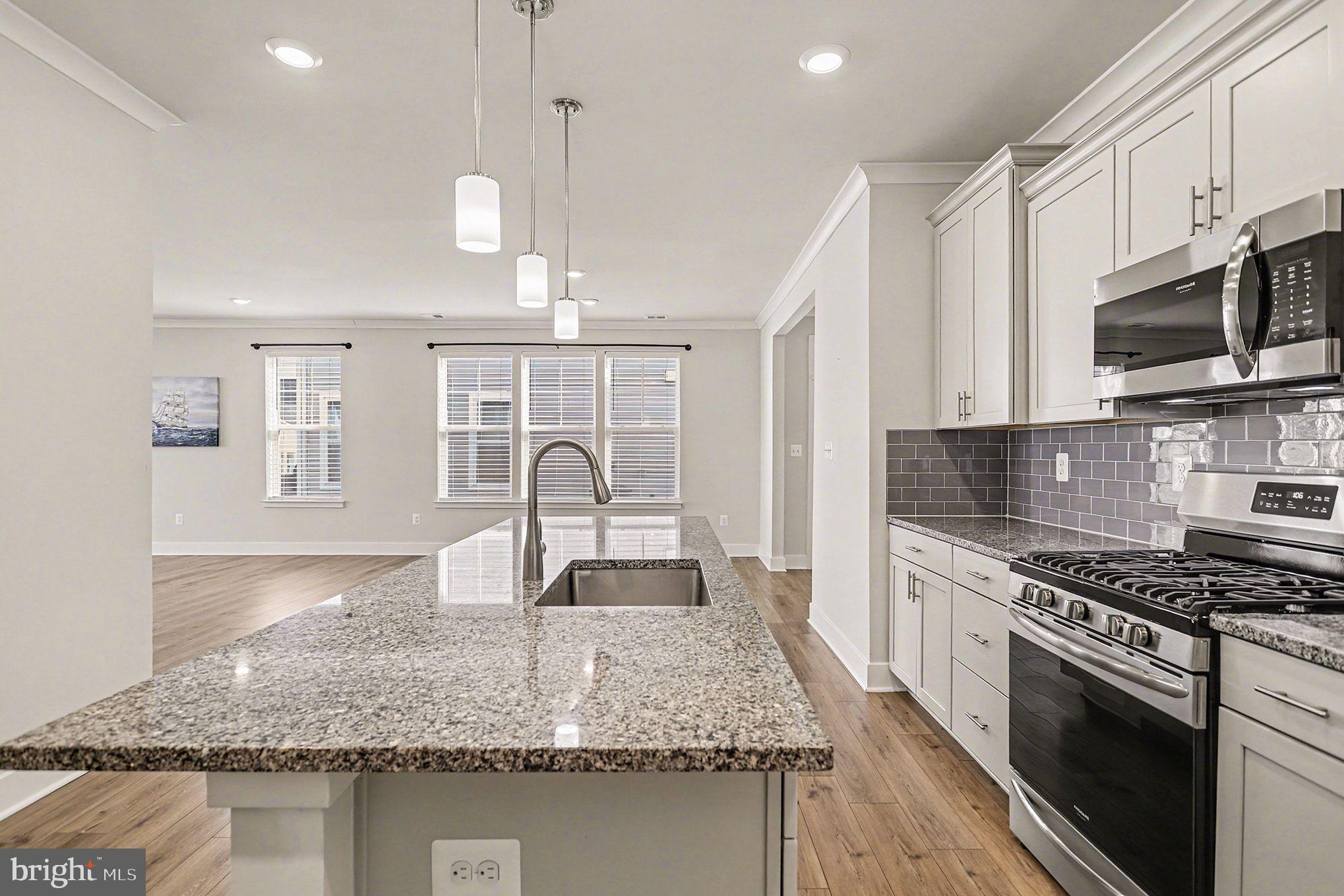 63 Rustic Wood Drive Gettysburg, PA 17325 - Photo 12 of 49 a kitchen with stainless steel appliances granite countertop a sink stove microwave and refrigerator