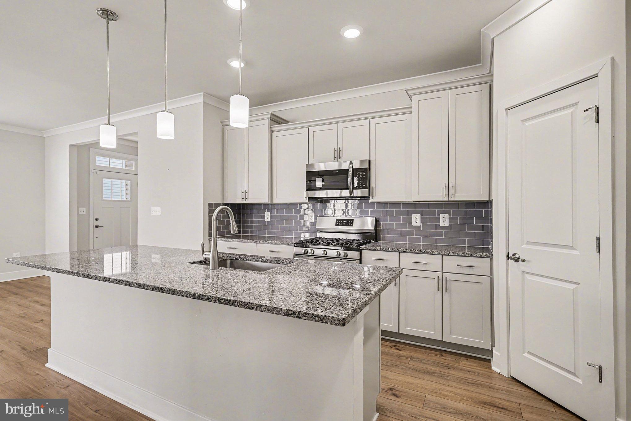 63 Rustic Wood Drive Gettysburg, PA 17325 - Photo 13 of 49 a kitchen with kitchen island granite countertop a sink appliances cabinets and counter space