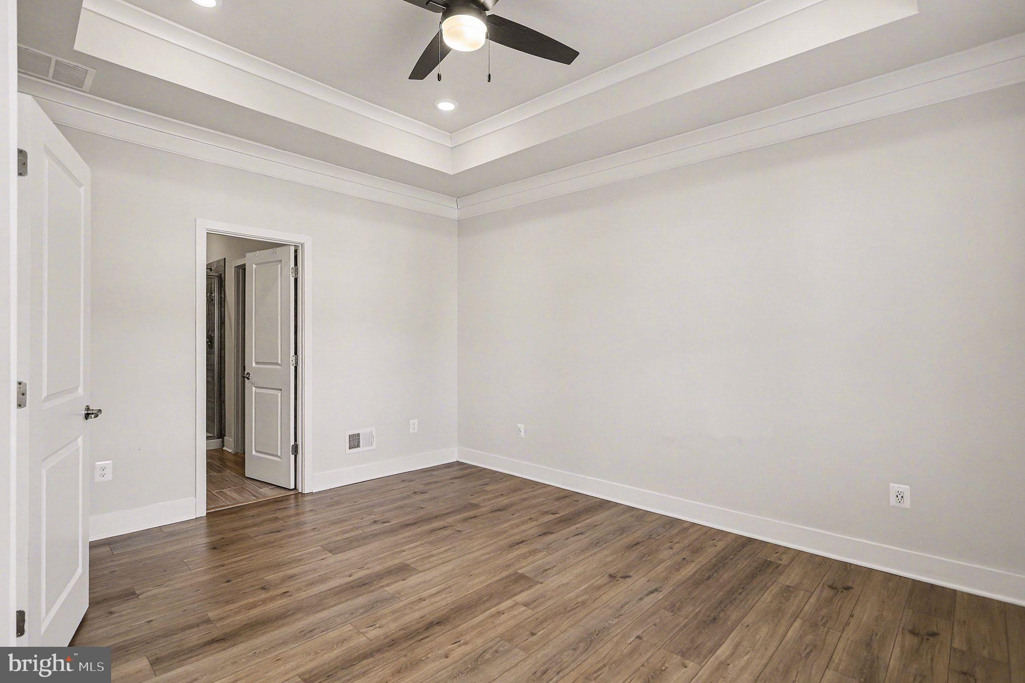 63 Rustic Wood Drive Gettysburg, PA 17325 - Photo 17 of 49 an empty room with wooden floor and windows